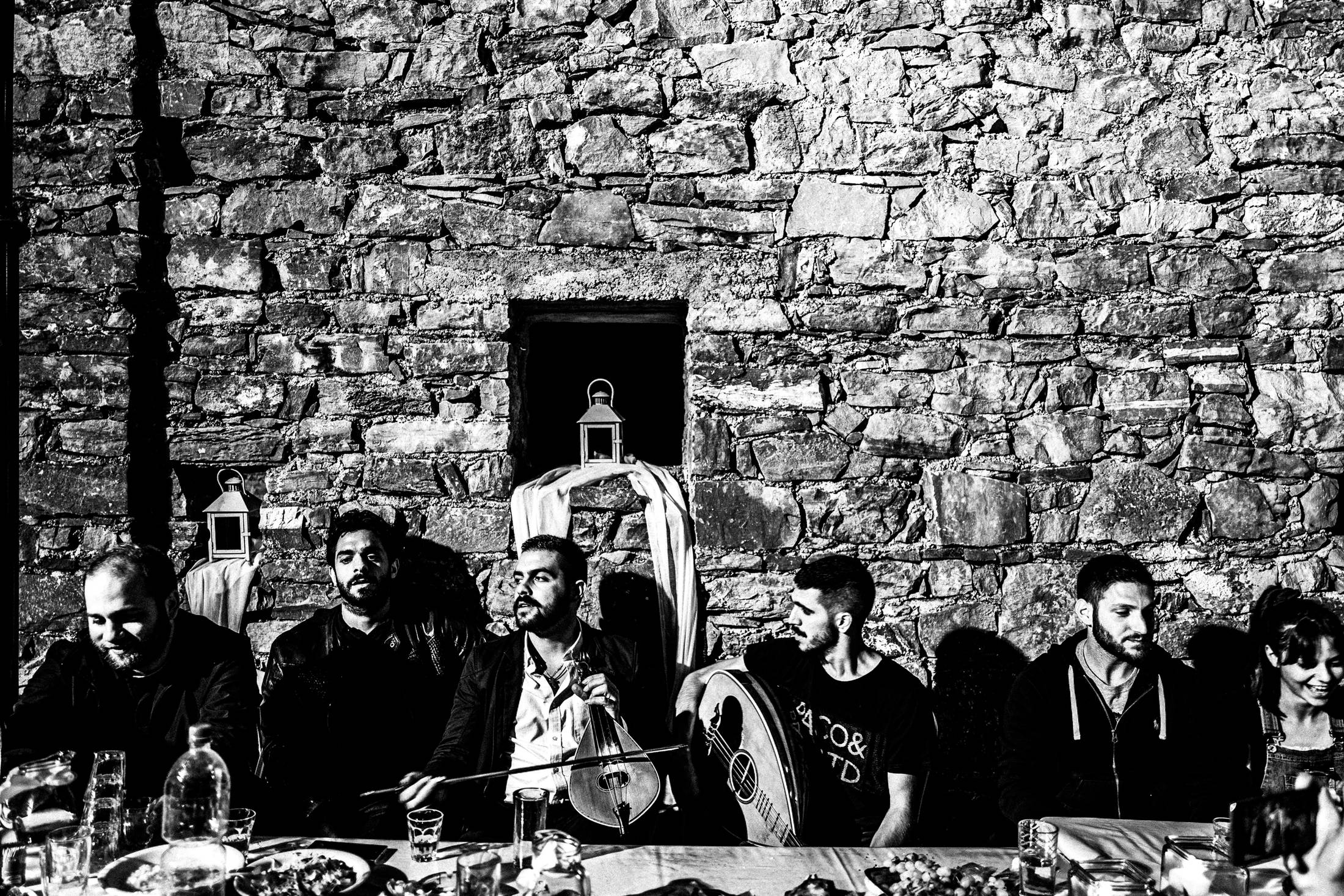 Music and singing mantinades at the pre-wedding party, Anogia, Rethymnonm, Crete, by photographer George Tatakis