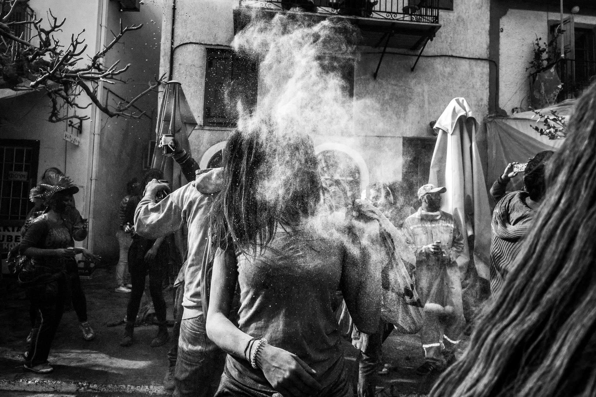 Flour gets in your face at the flour wars in Galaxidi, by photographer George Tatakis