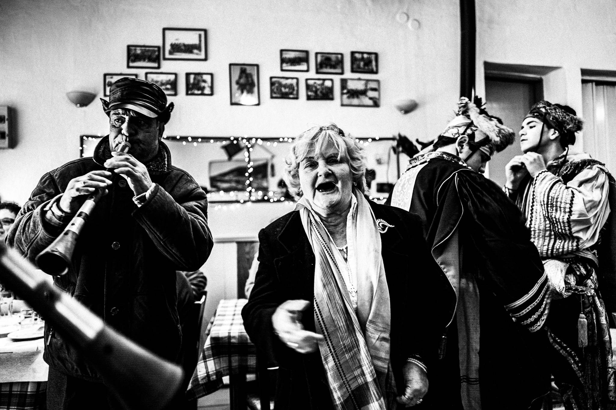 Singing at the café, Pagan Christmas customs of Northern Greece, by photographer George Tatakis