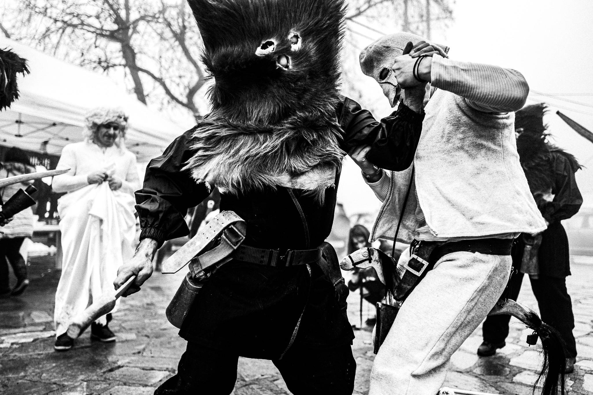The doctor healing the wounded Charapis at Pagoneri, Pagan Christmas customs of Northern Greece, by photographer George Tatakis