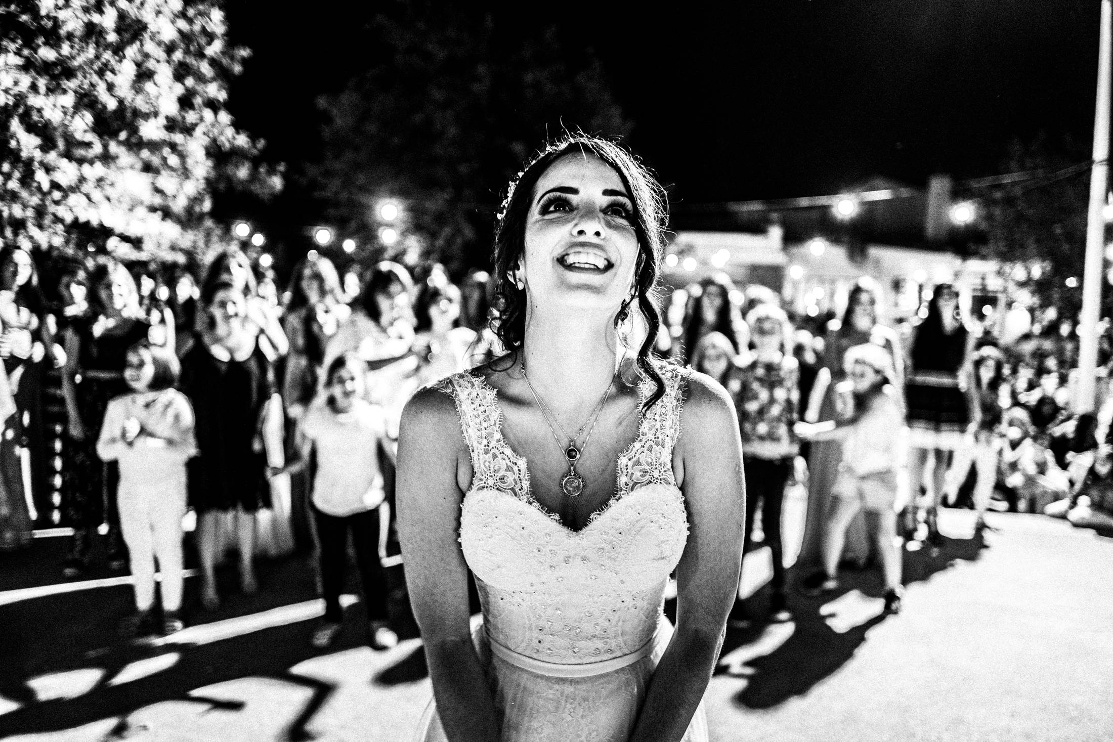 The bouquet toss after the wedding, Anogia, Rethymnon, Crete, by photographer George Tatakis