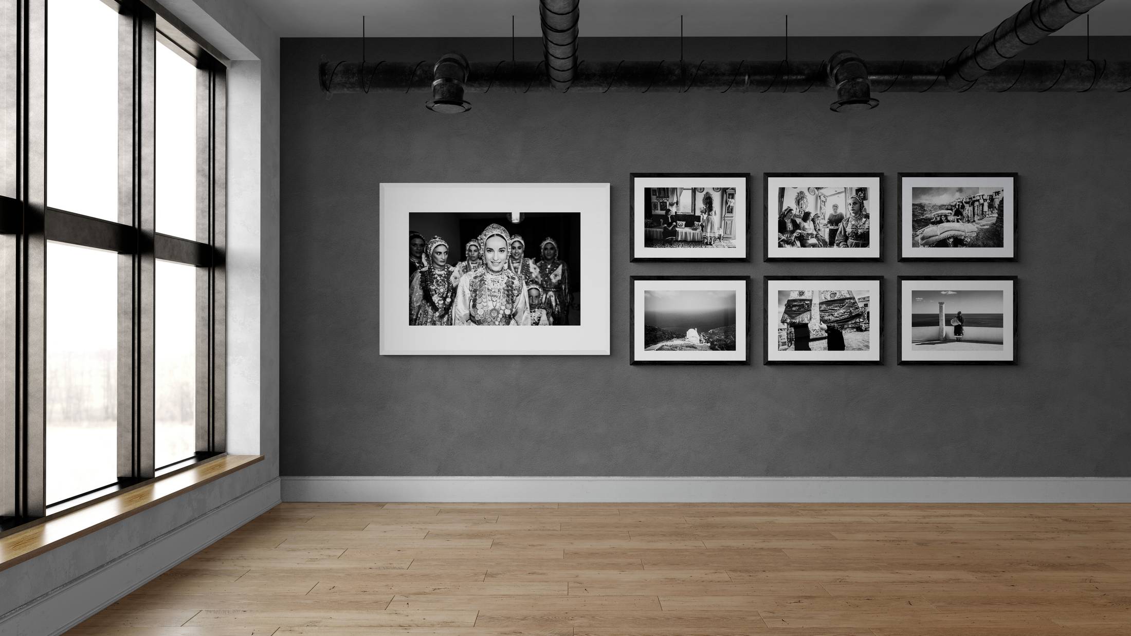 Olympos, Karpathos. Collection of prints in a room. By photographer George Tatakis