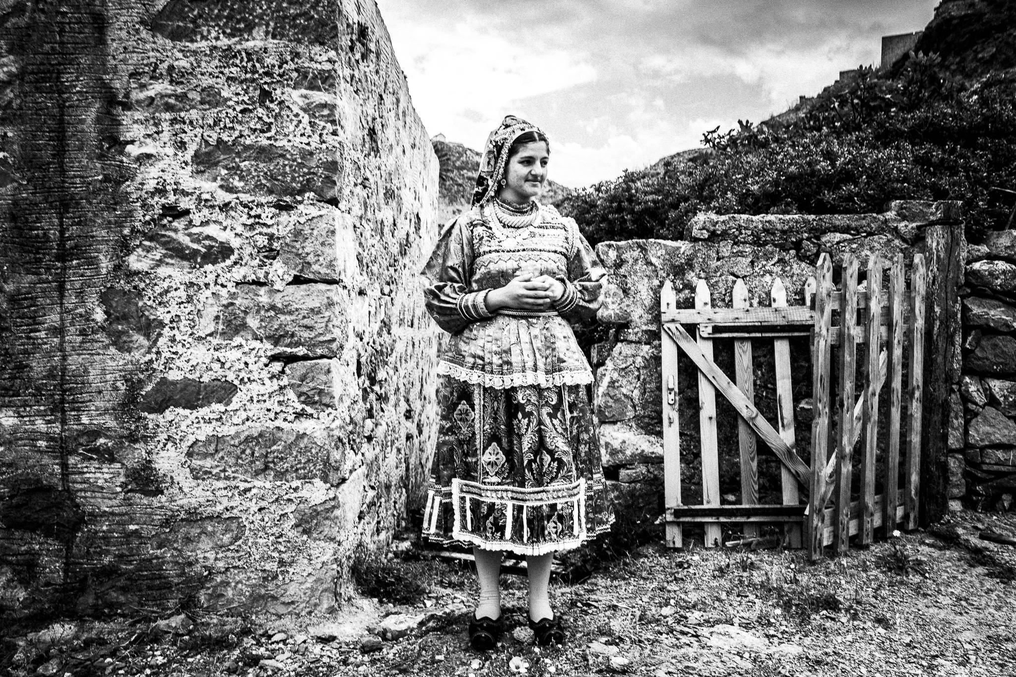 A young woman, wearing the local traditional costume. Olympos, Karpathos, Greece. 