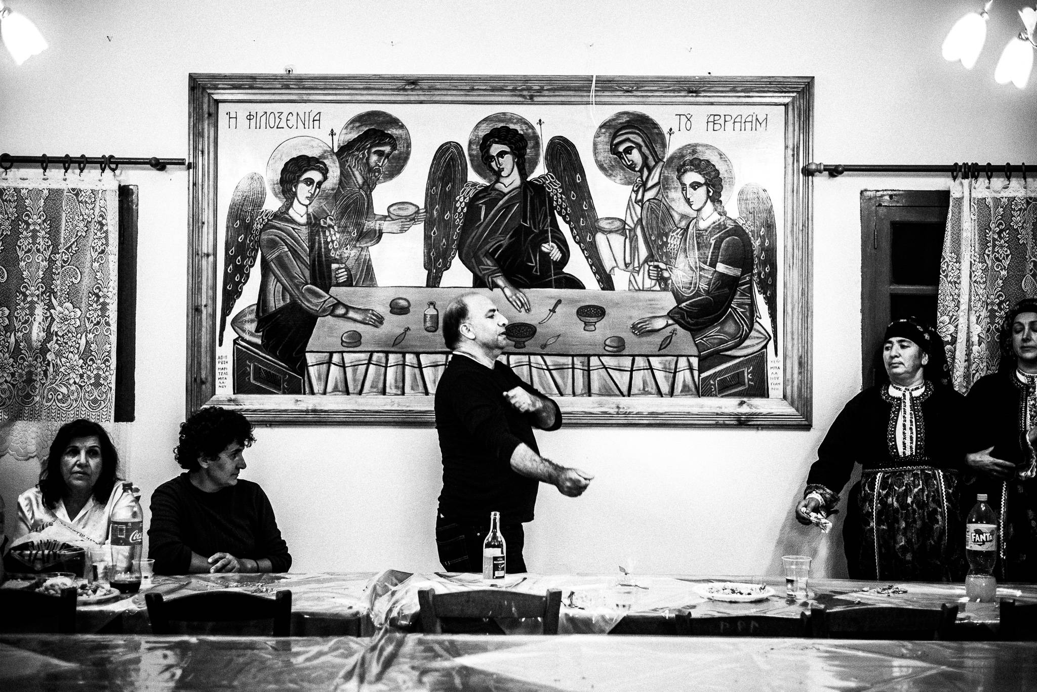 Dancing Pano Choros during the festival of St. Minas, Olympos, Karpathos, Greece. Black and white photography by George Tatakis
