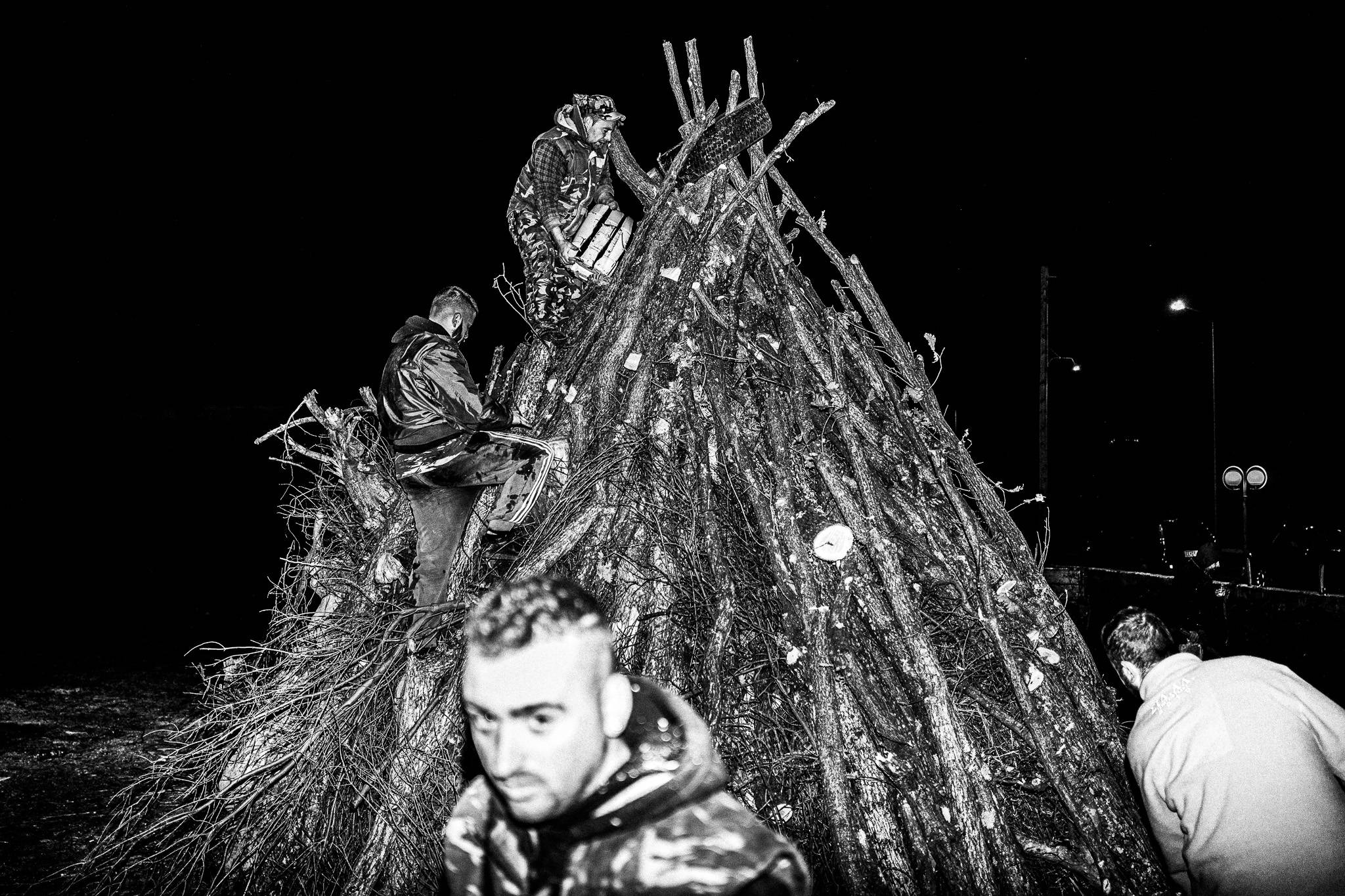 Final touches during nightfall, Pagan Christmas customs of Northern Greece, by photographer George Tatakis