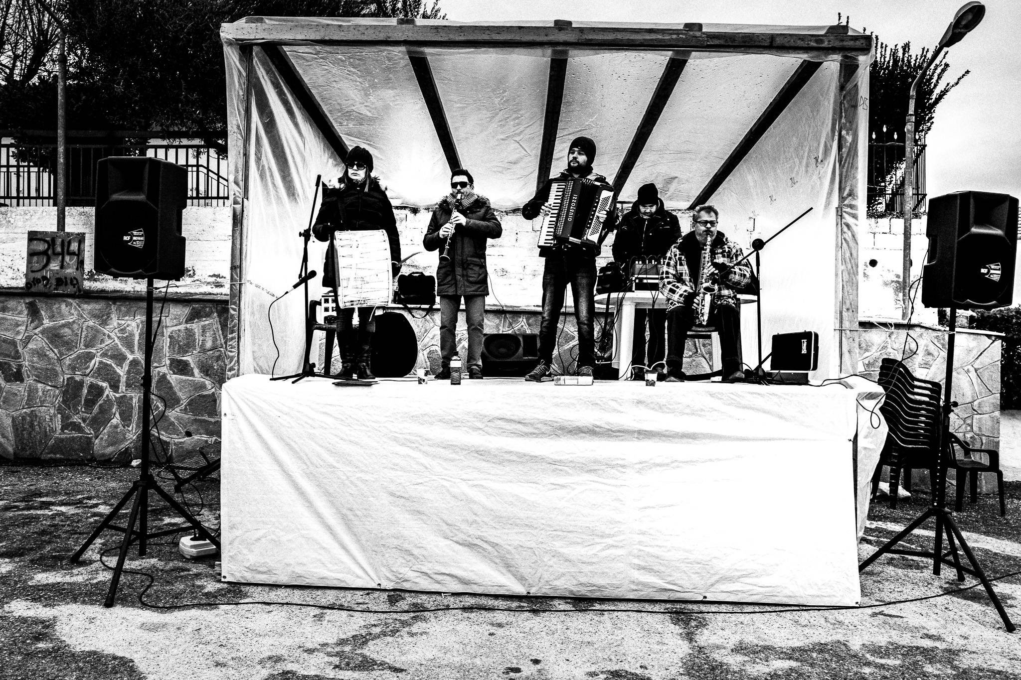 The music band at the main square of Profitis, Pagan Christmas customs of Northern Greece, by photographer George Tatakis