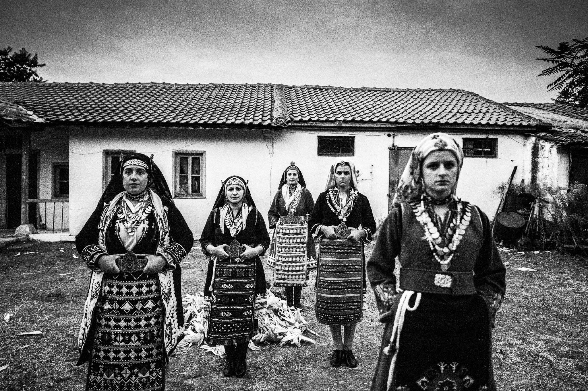 The ladies in front of a local traditional house in Thyrea, Evros, Greece, by photographer George Tatakis