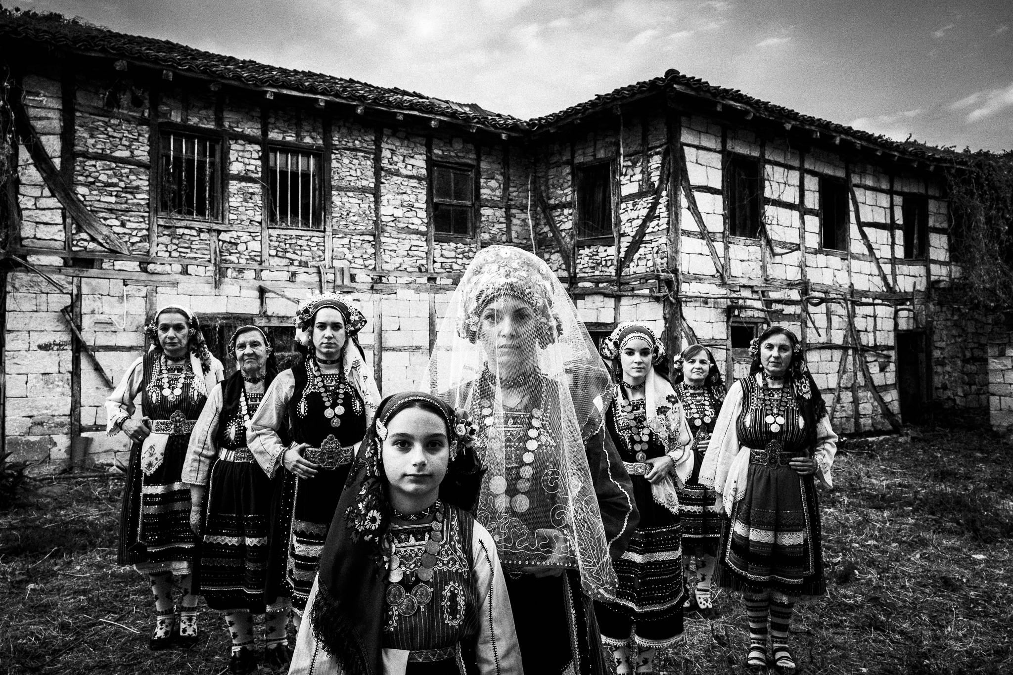 Costumes of Metaxades, in front of a local traditional house, Evros, Thrace, Greece, by photographer George Tatakis