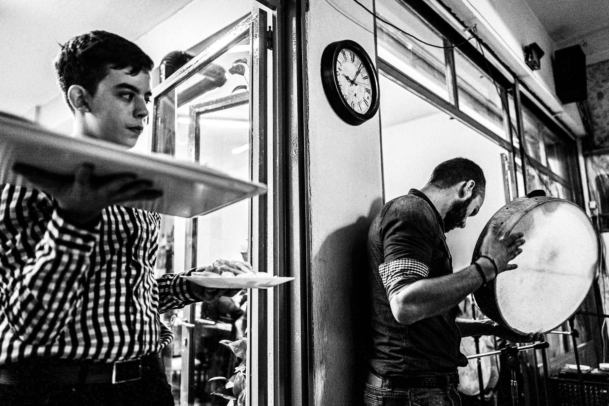 Serving food at Pyrgi village, Pagan Christmas customs of Northern Greece, by photographer George Tatakis