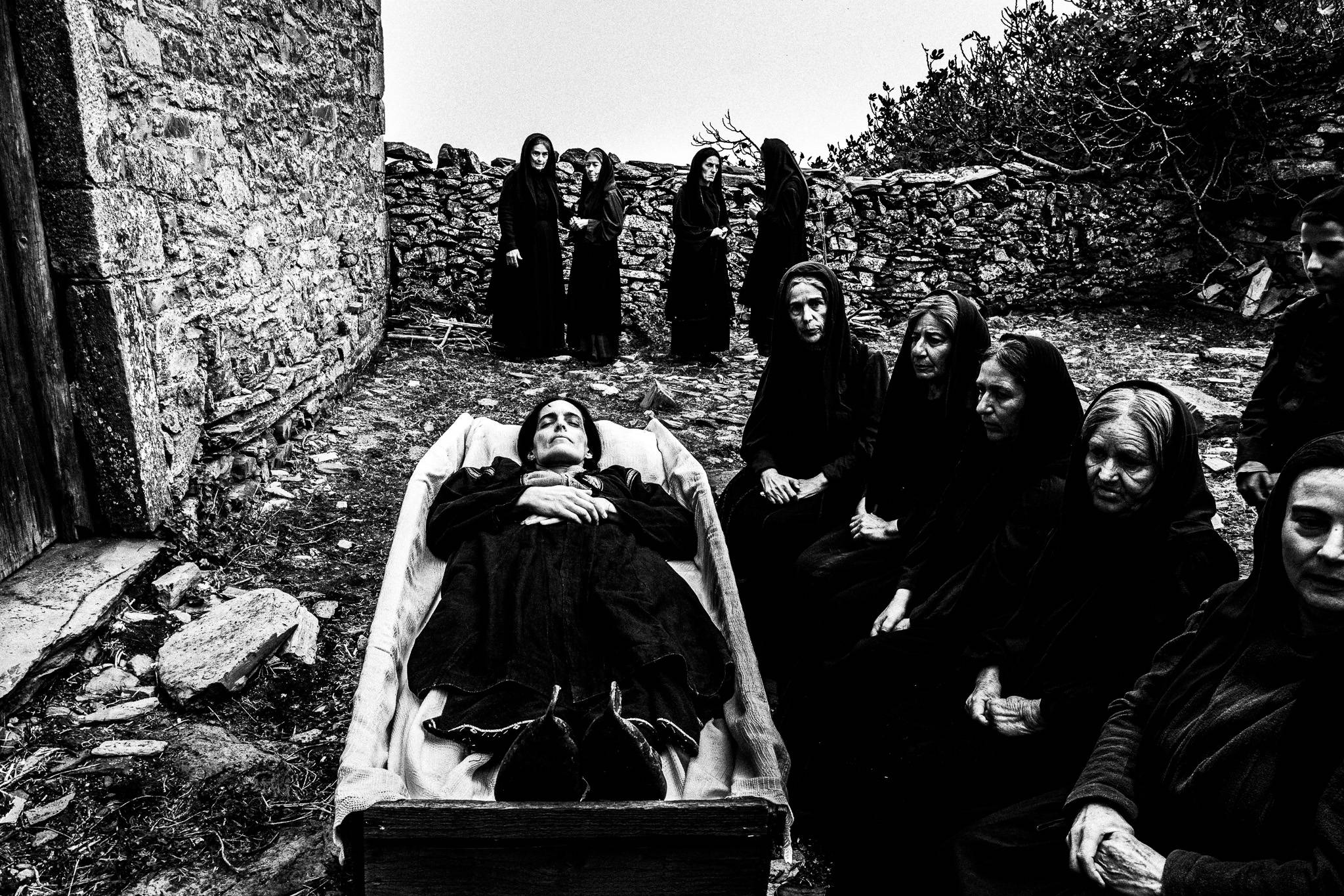 The corpse inside the coffin during a local funeral. Black and white photography by George Tatakis during the filming of 'Φόνισσα'(Fonissa).