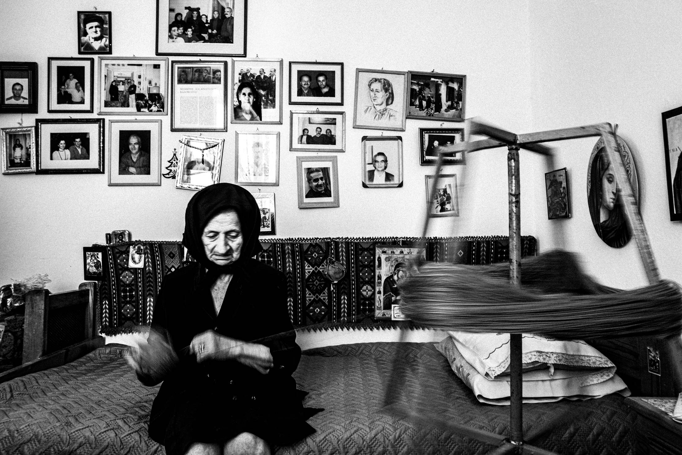 Hermione at her shop in Anogia, Rethymnon, Crete, by photographer George Tatakis
