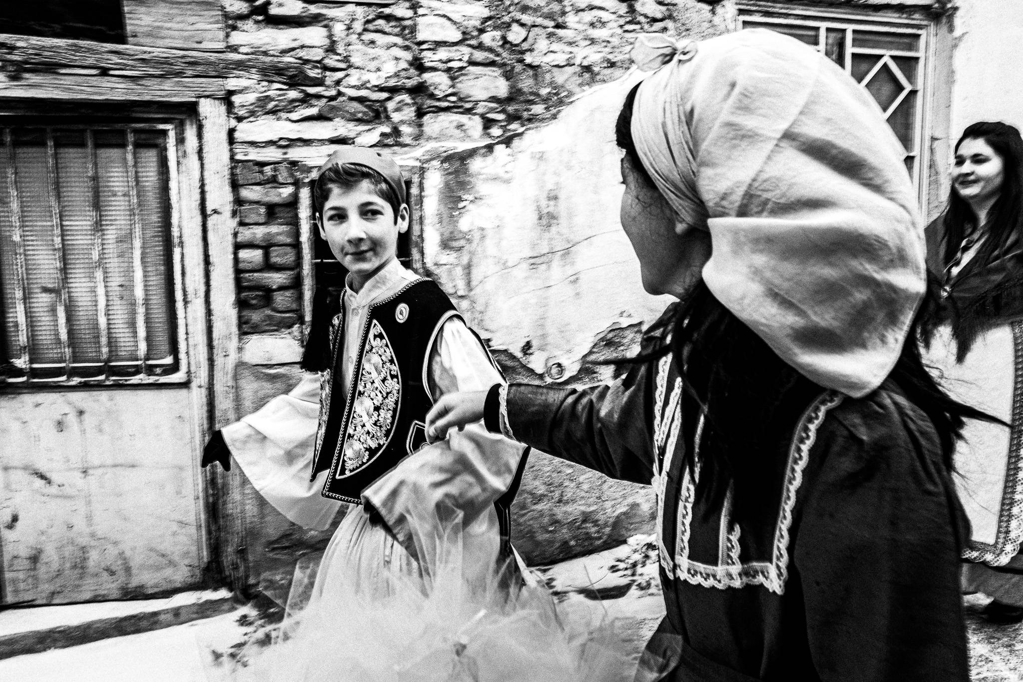 The couple round the village, Pagan Christmas customs of Northern Greece, by photographer George Tatakis