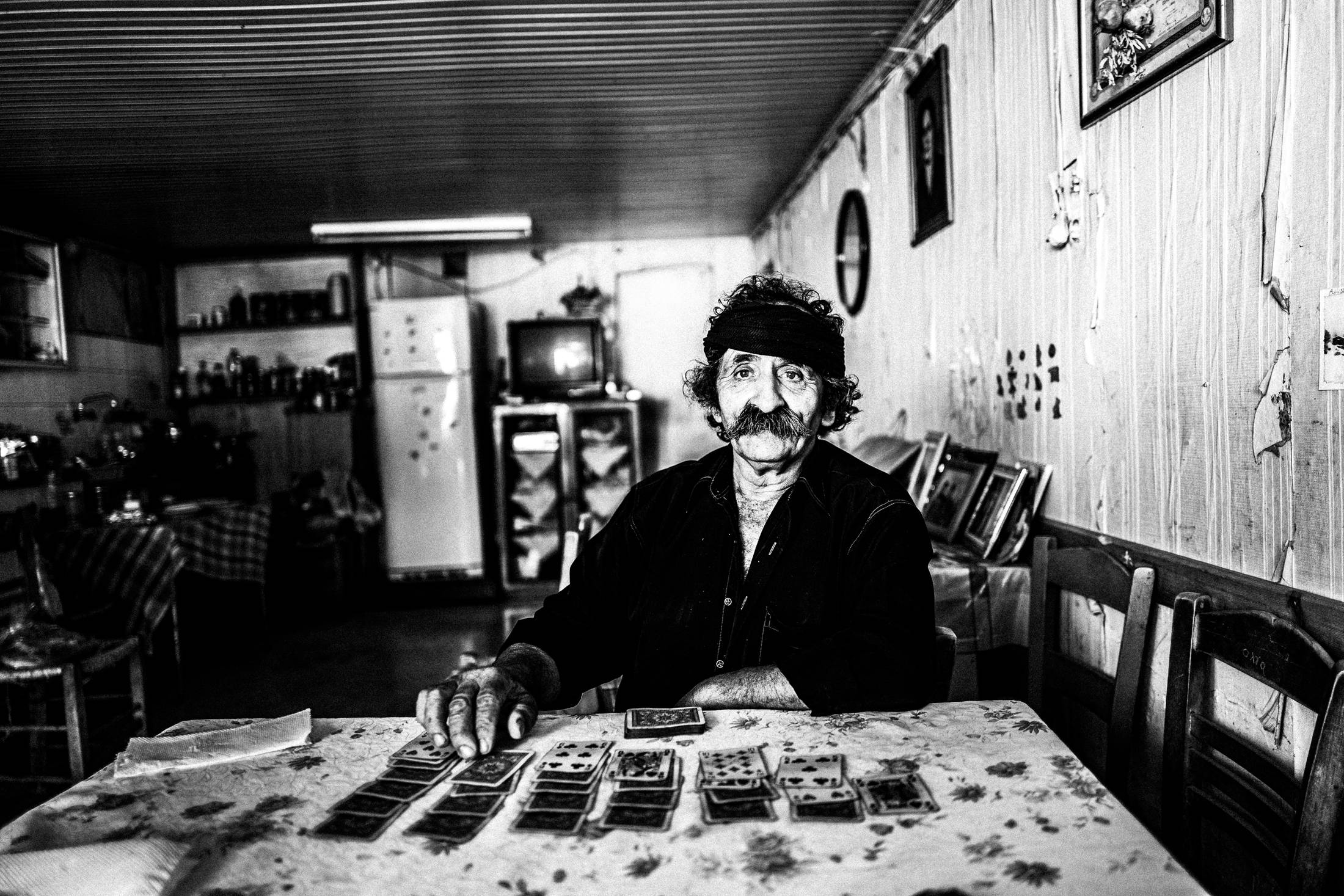 Lefteris inside his café in Anogia, Rethymnon, Crete, by photographer George Tatakis