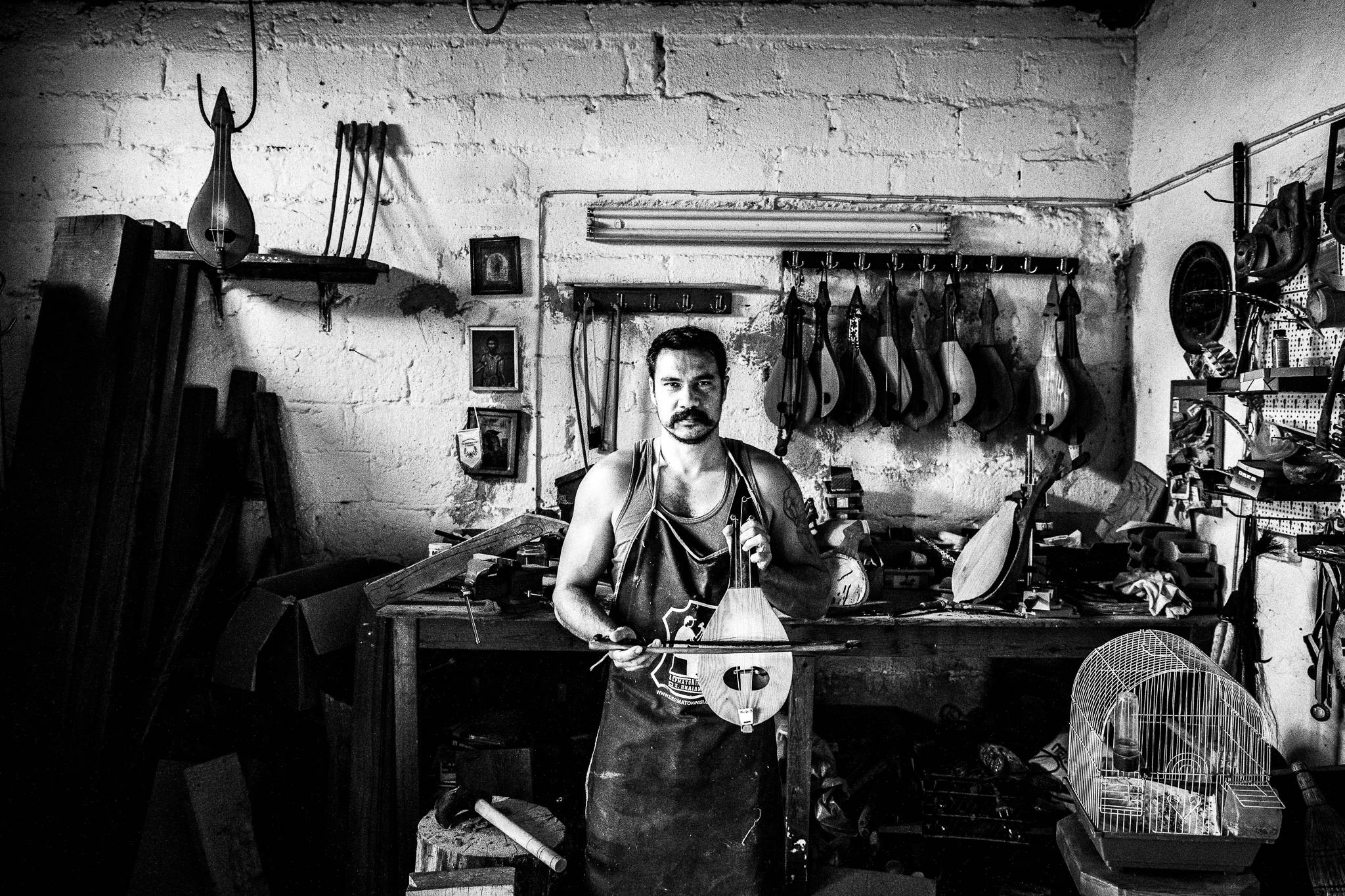 Alex in his lyre workshop, at Thourion village, Evros, Thrace, Greece, by photographer George Tatakis