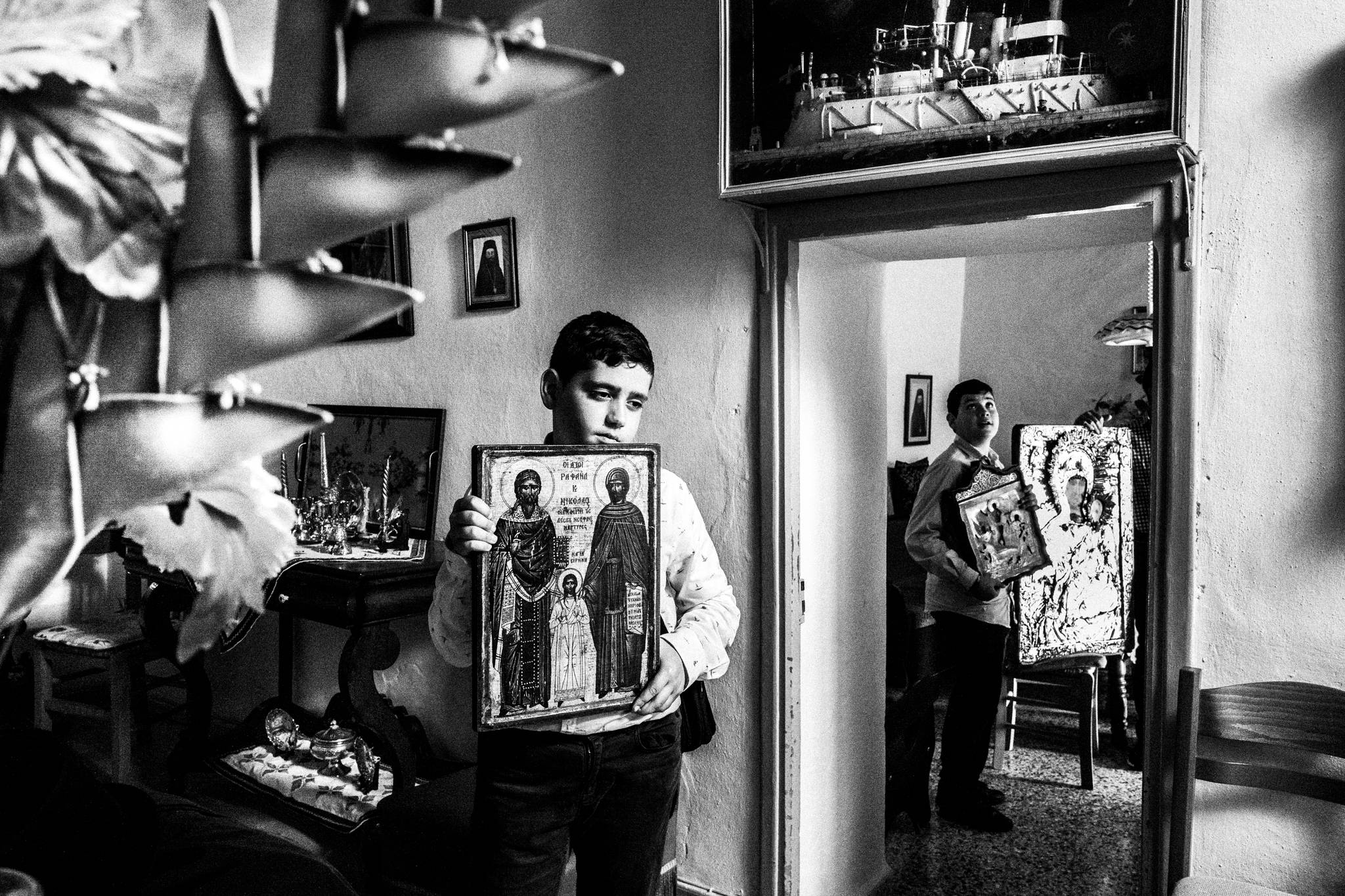 The local Icons getting inside houses for blessing in Patmos island, by photographer George Tatakis
