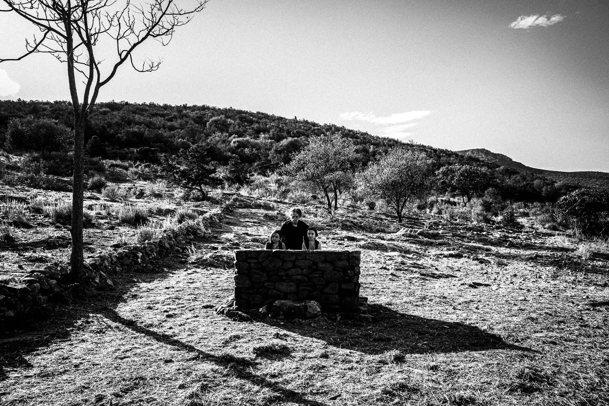 The Fonissa with two children. Black and white photography by George Tatakis during the filming of 'Φόνισσα'(Fonissa).