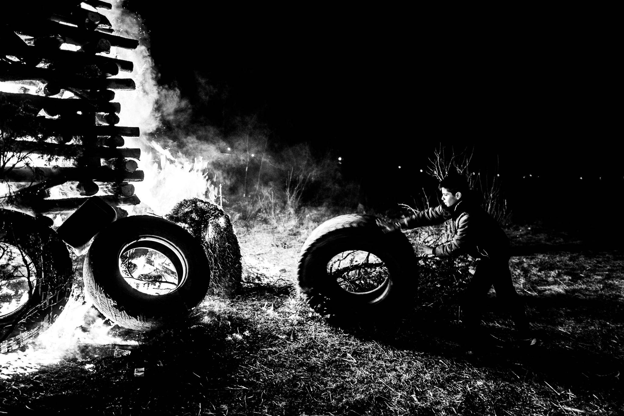 Pushing fuel towards the fire, Pagan Christmas customs of Northern Greece, by photographer George Tatakis