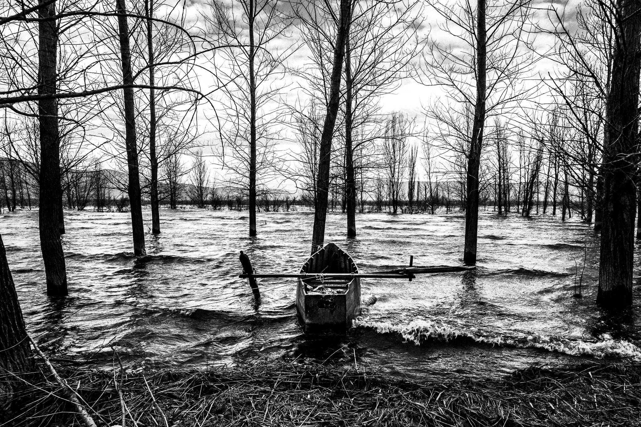 The eery atmosphere of lake Diorani, Pagan Christmas customs of Northern Greece, by photographer George Tatakis