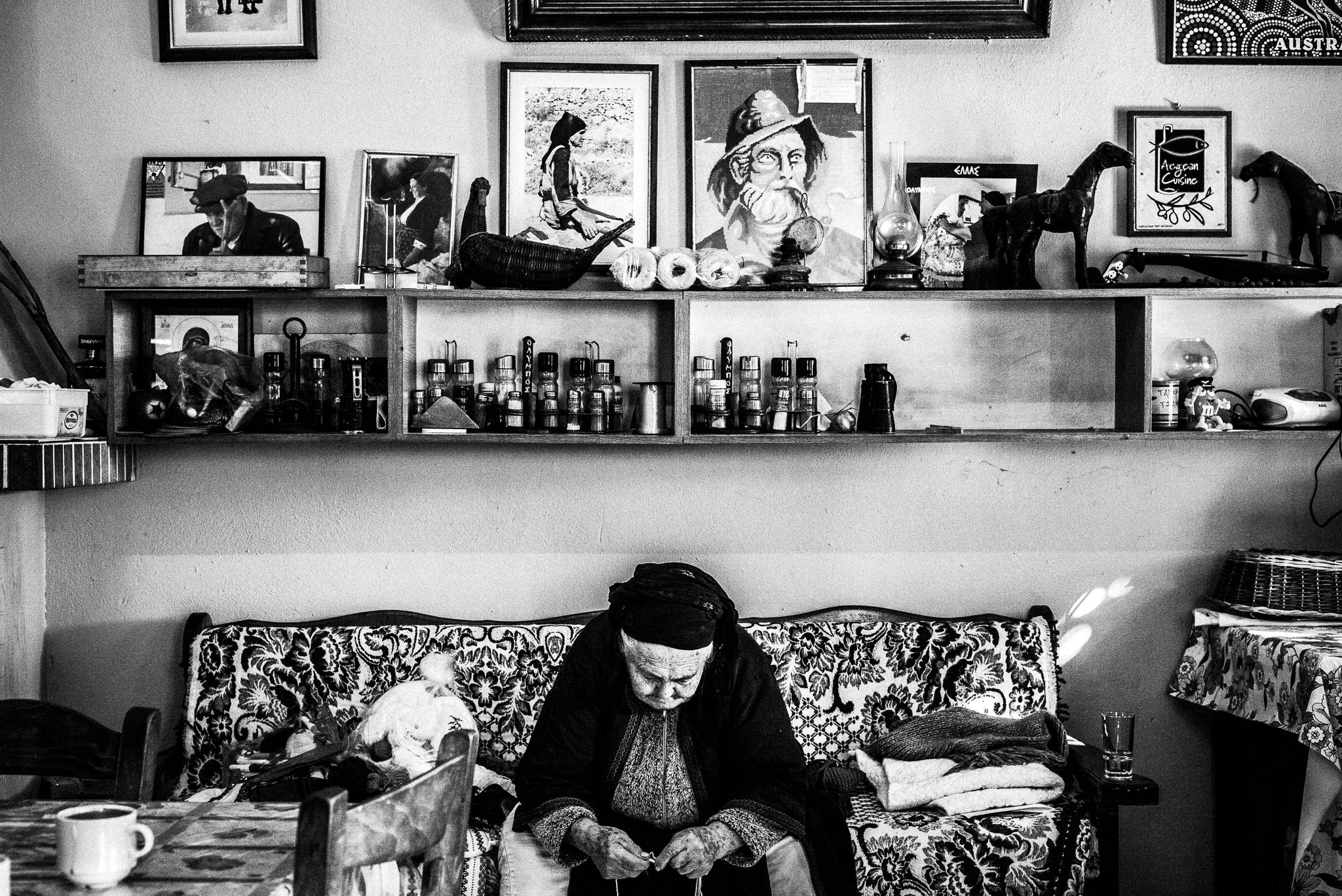 Inside Michalis' tavern, the only place to go in Avlona, Olympos, Karpathos, Greece. Black and white photography by George Tatakis