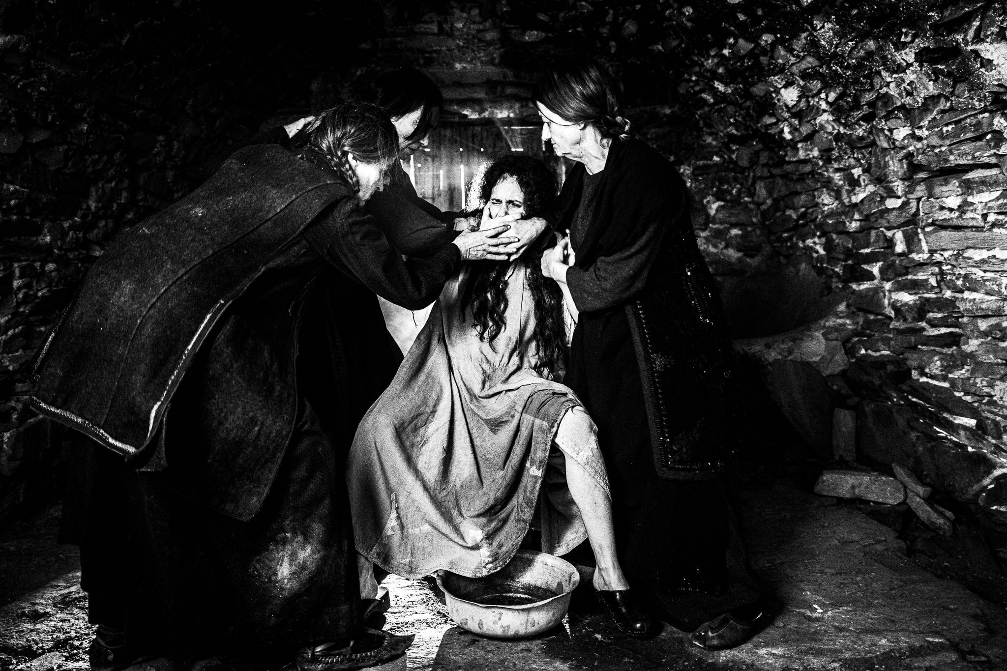 Filming the scene of the abortion. Black and white photography by George Tatakis during the filming of 'Φόνισσα'(Fonissa).