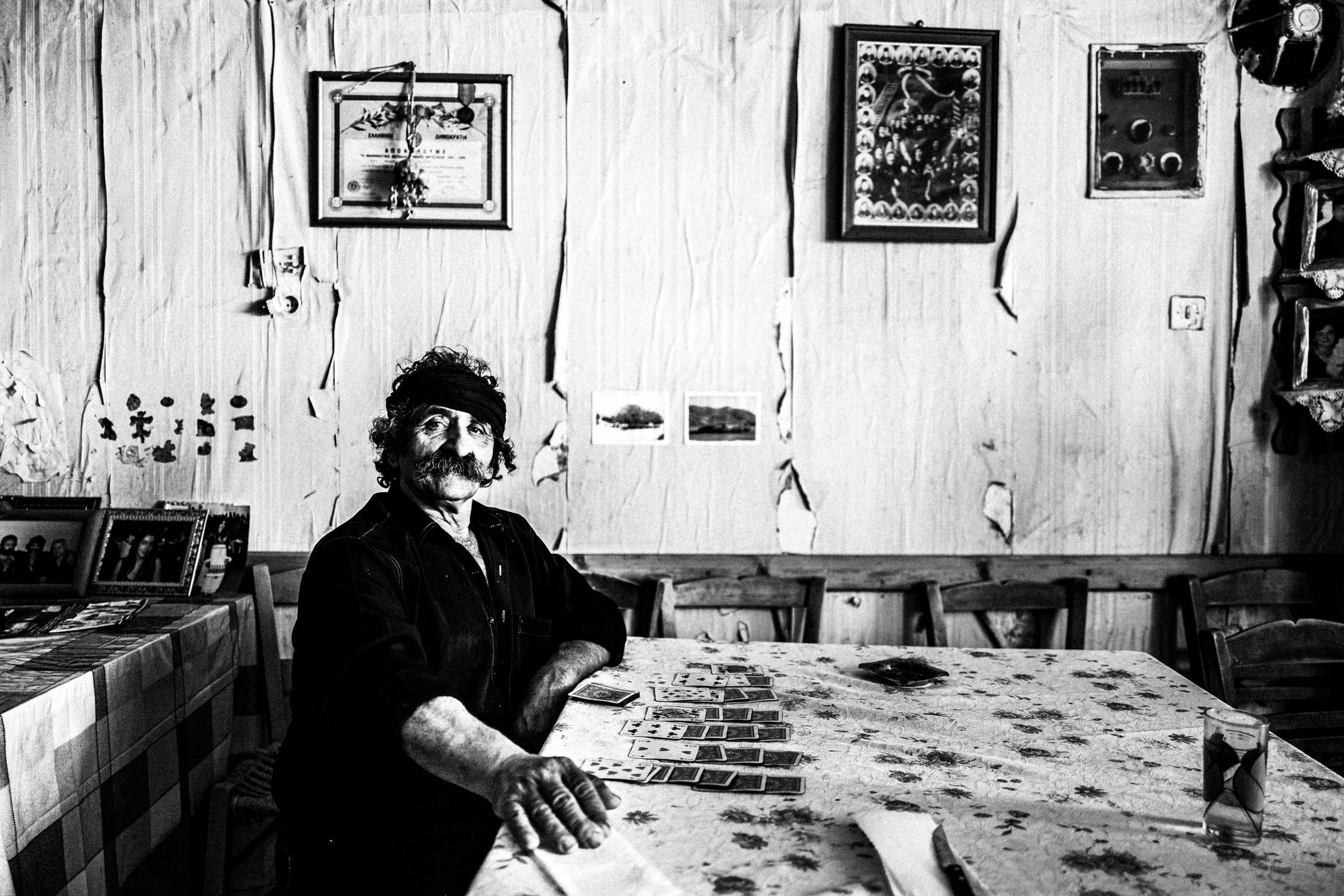 Lefteris inside his café in Anogia, Rethymnon, Crete, by photographer George Tatakis