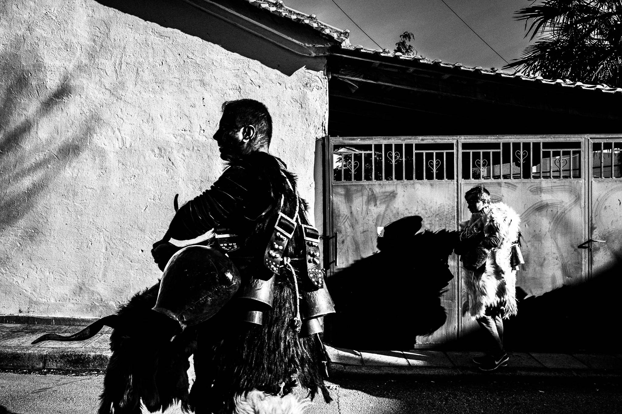 Arapides in the streets, Pagan Christmas customs of Northern Greece, by photographer George Tatakis