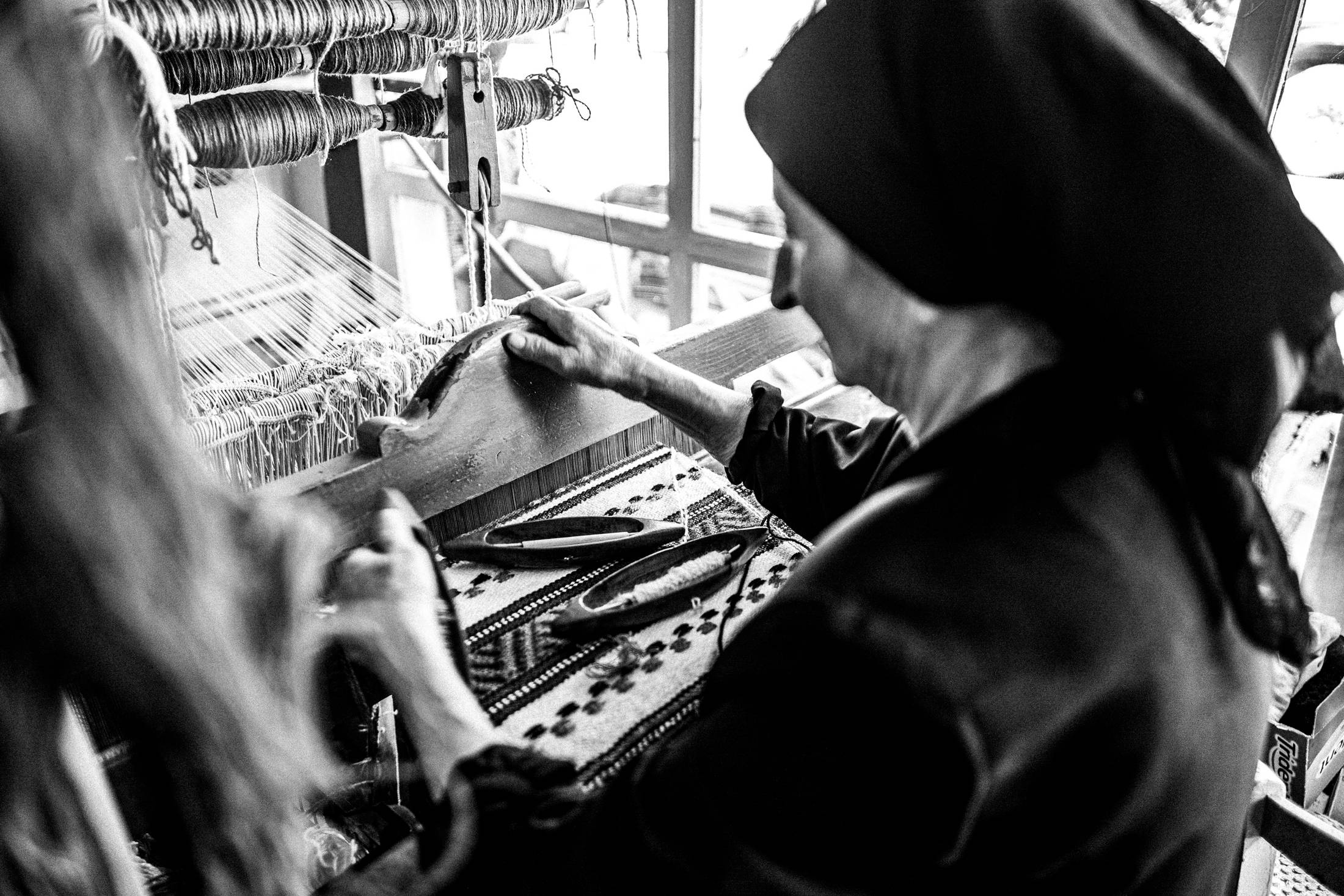 Hermione at her shop in Anogia, Rethymnon, Crete, by photographer George Tatakis