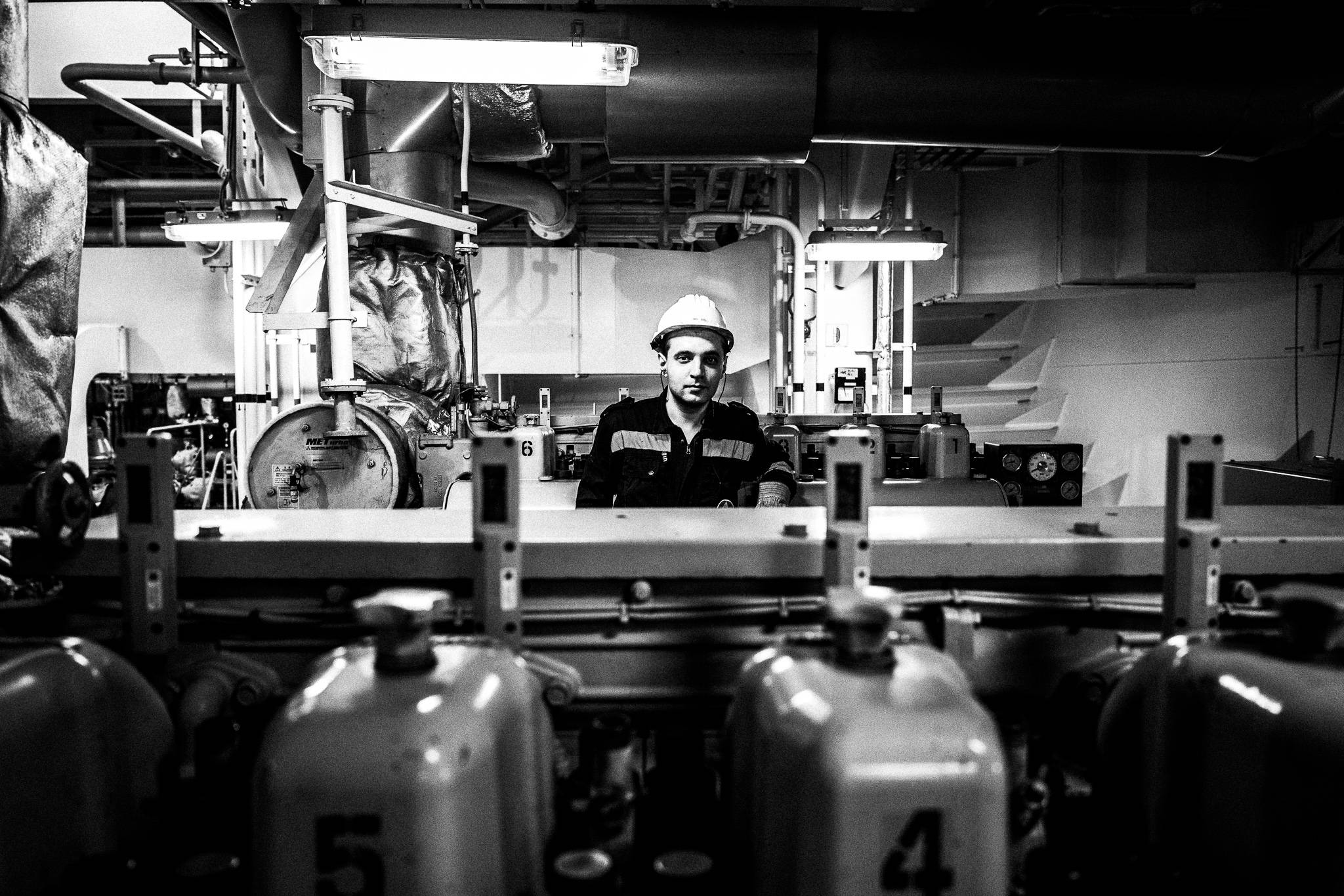 Engineer by the auxiliary Diesel engine, by photographer George Tatakis