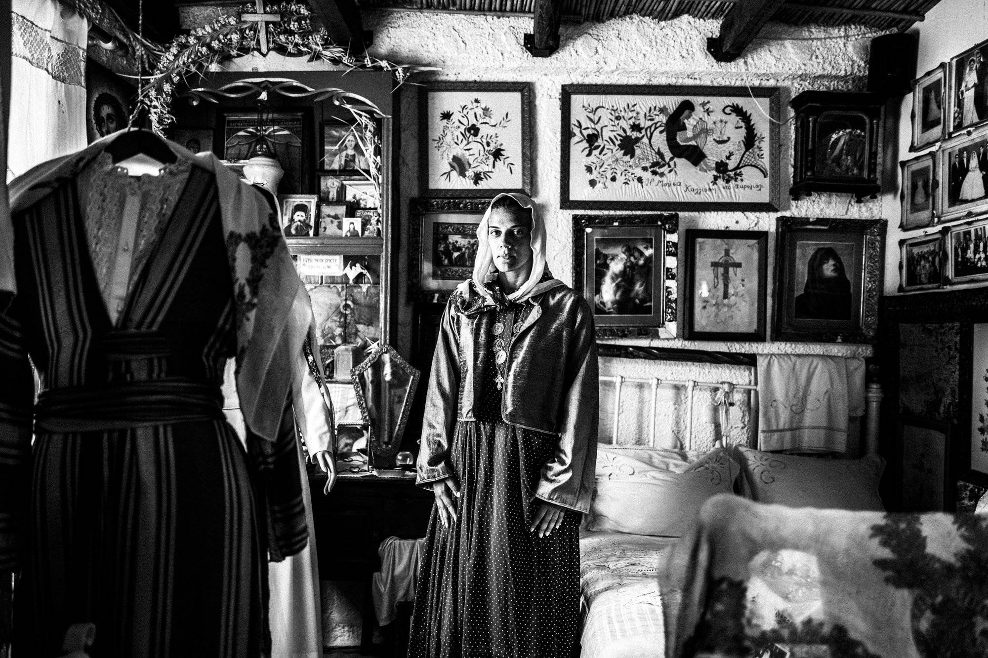 Christina in the traditional urban dress in a traditional Kalymnian home Greece. South Aegean. Photographer George Tatakis