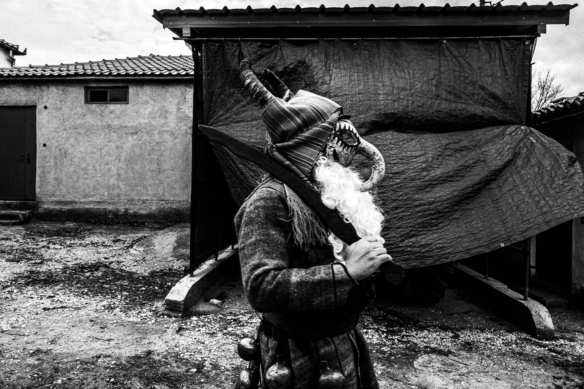 Purpuris around houses, Pagan Christmas customs of Northern Greece, by photographer George Tatakis