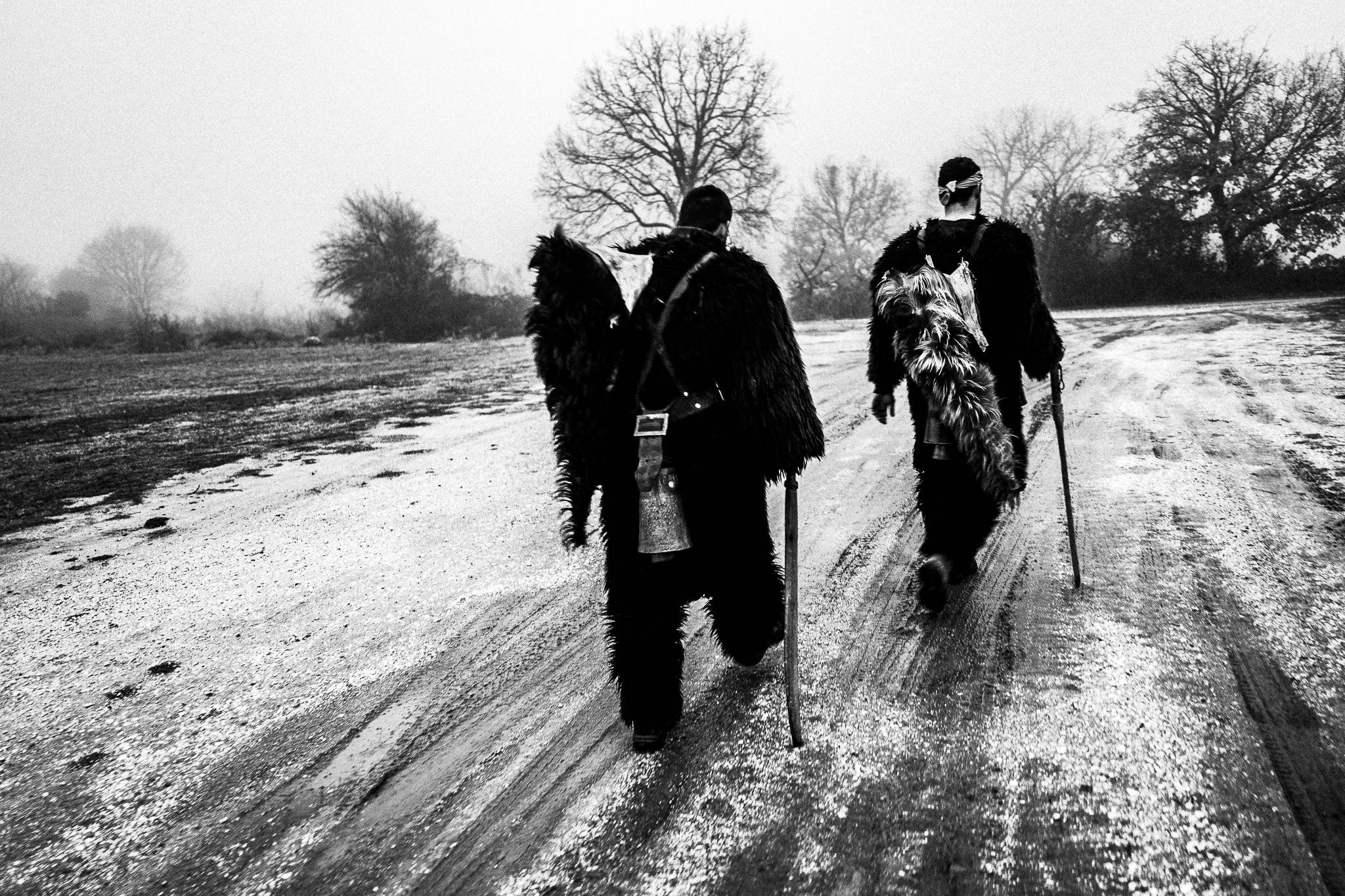 Visiting local houses in early morning at Monastiraki, Pagan Christmas customs of Northern Greece, by photographer George Tatakis