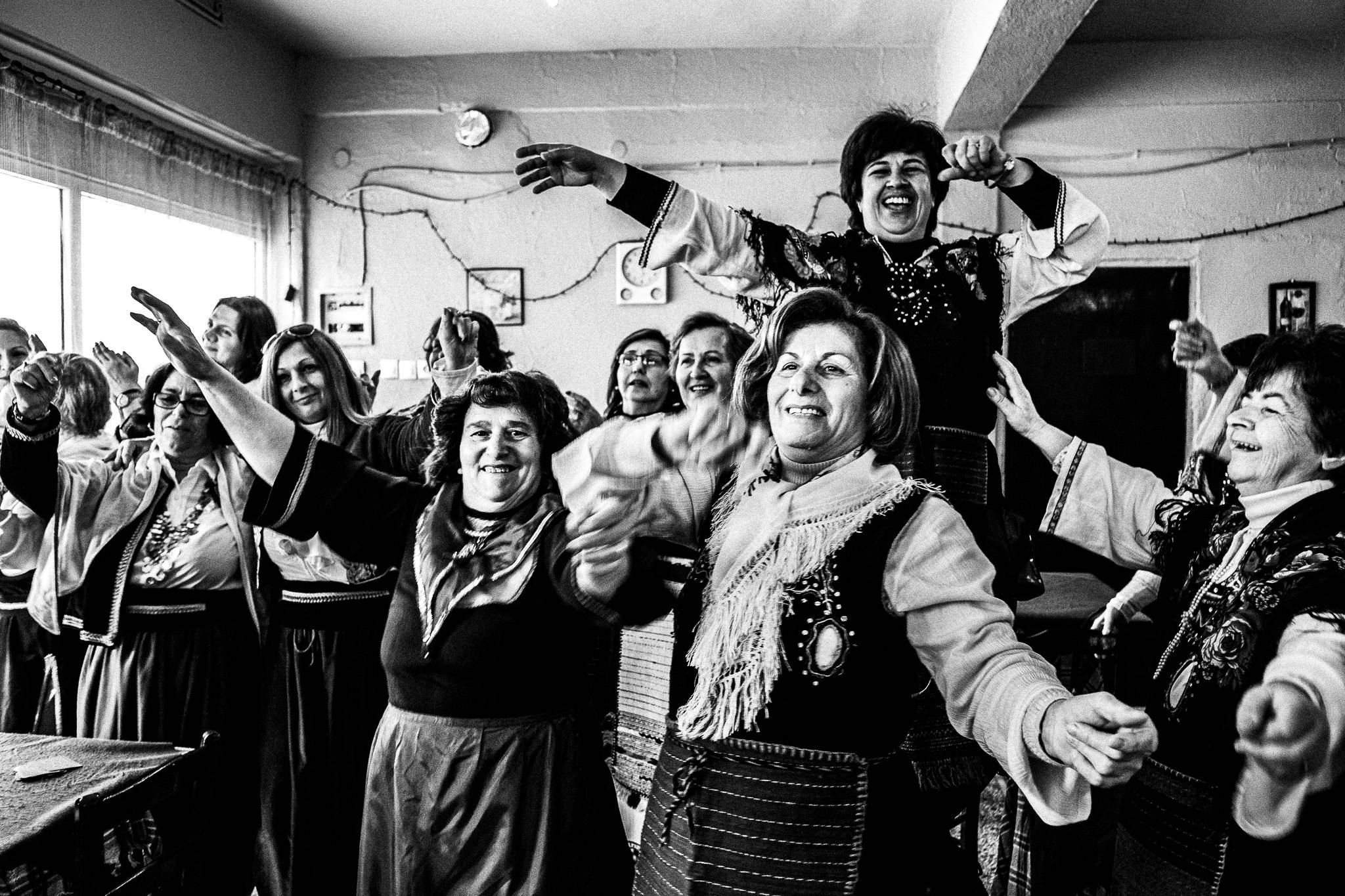 Having fun at the local café in Monokklisia of Serres, Pagan Christmas customs of Northern Greece, by photographer George Tatakis