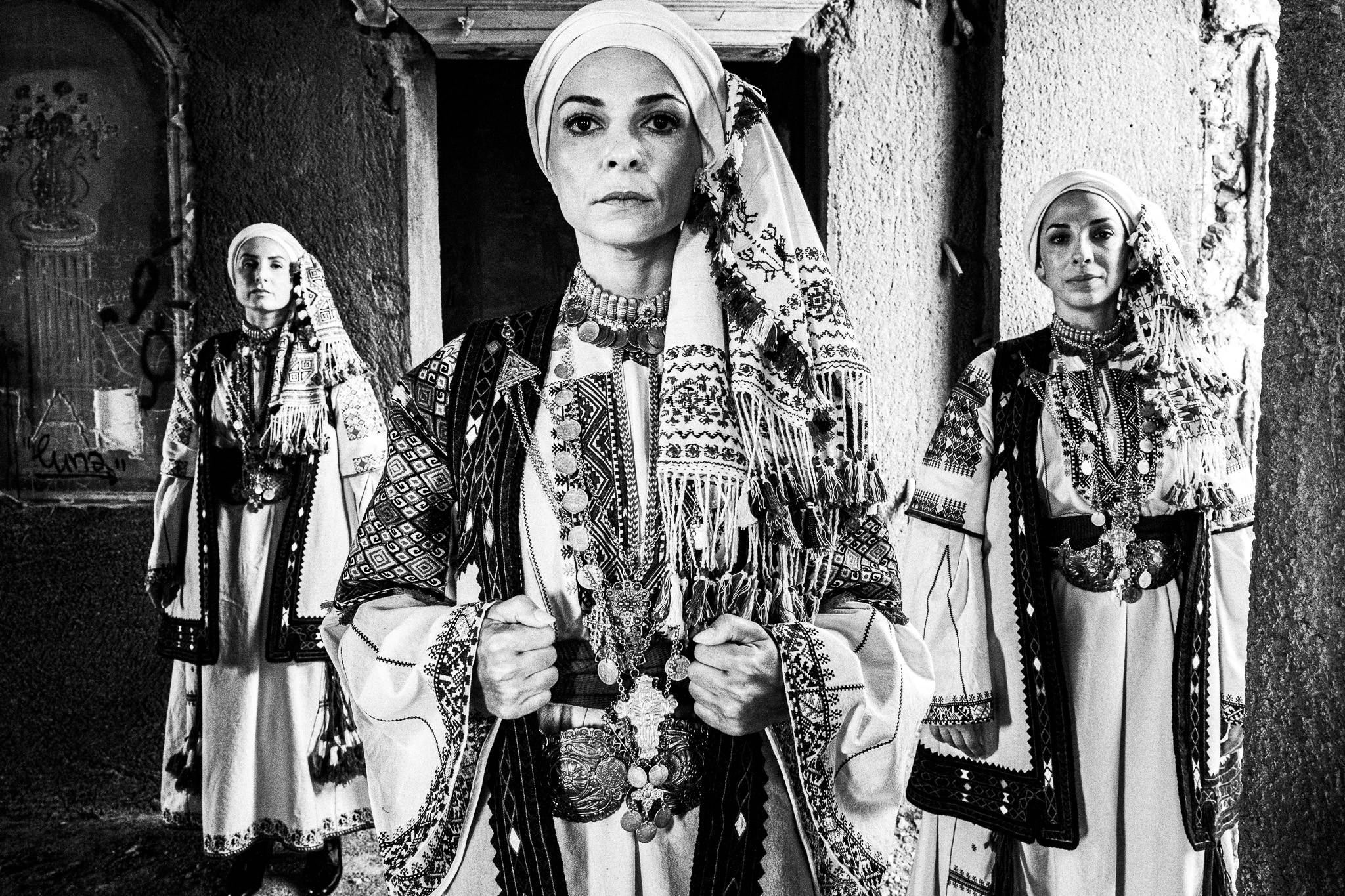 Three women wearing the local costumes of Kyparissia, in Peloponnese, Greece.