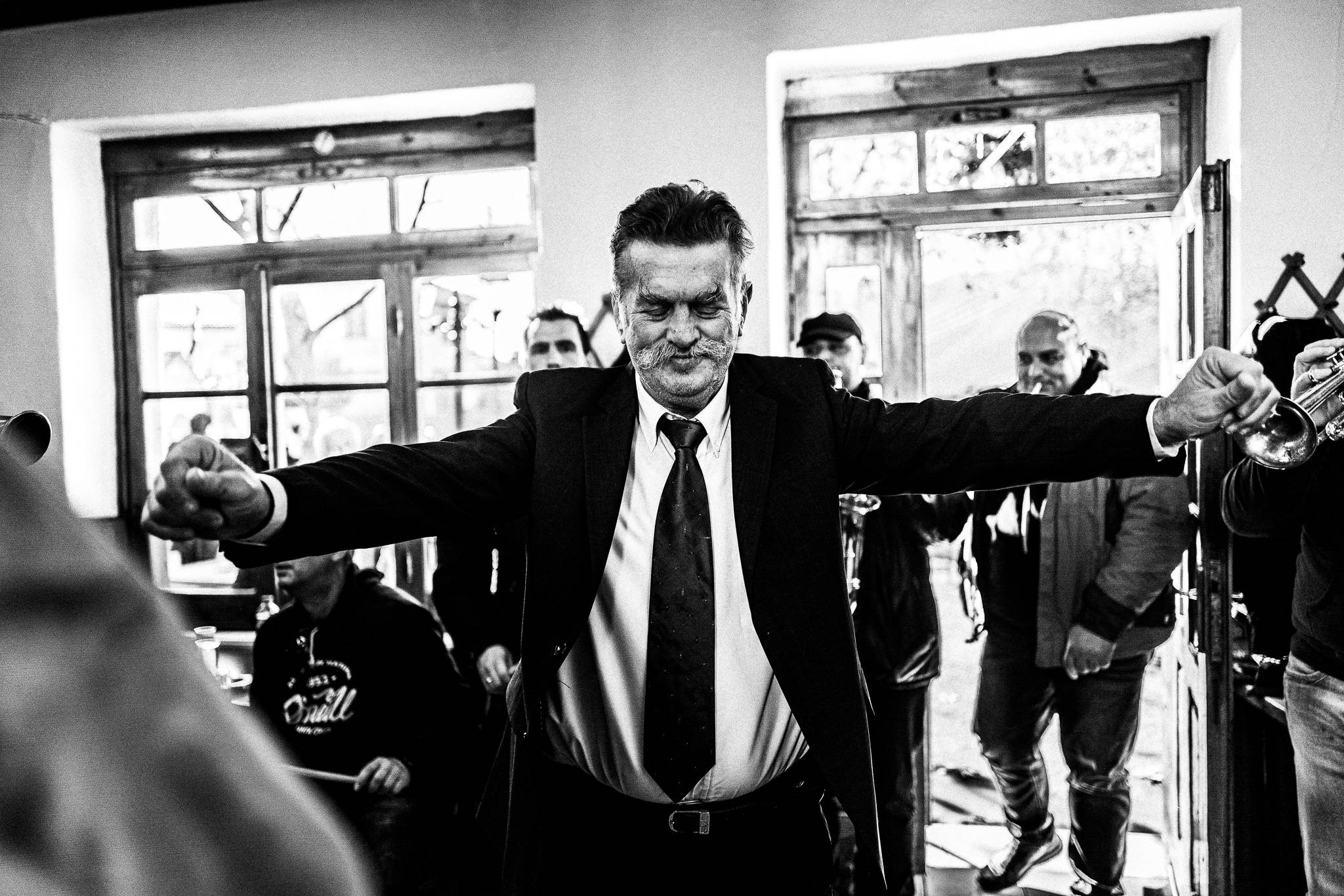 Dancing inside the café, Pagan Christmas customs of Northern Greece, by photographer George Tatakis