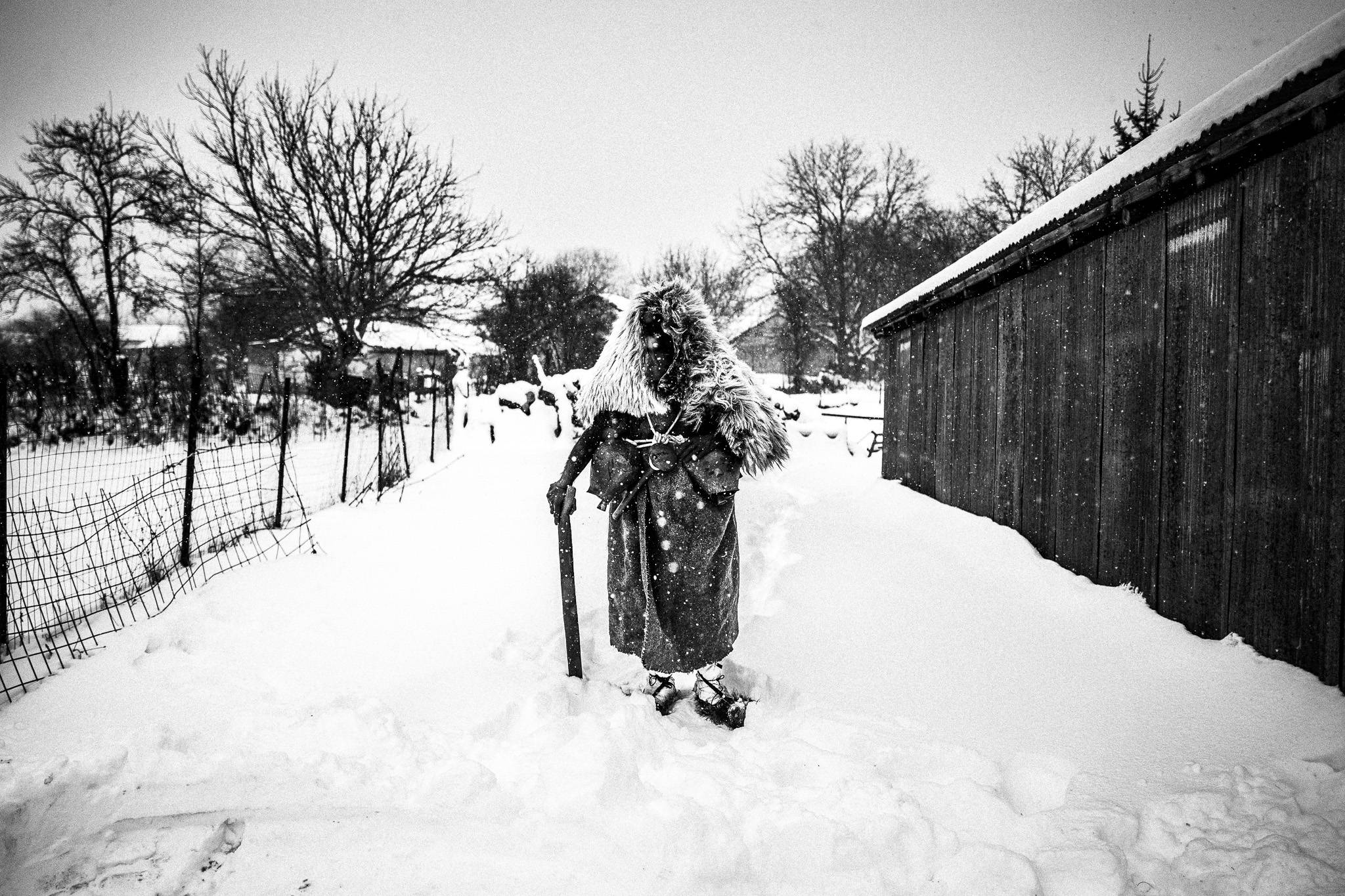 Arapis in the snow, Pagan Christmas customs of Northern Greece, by photographer George Tatakis