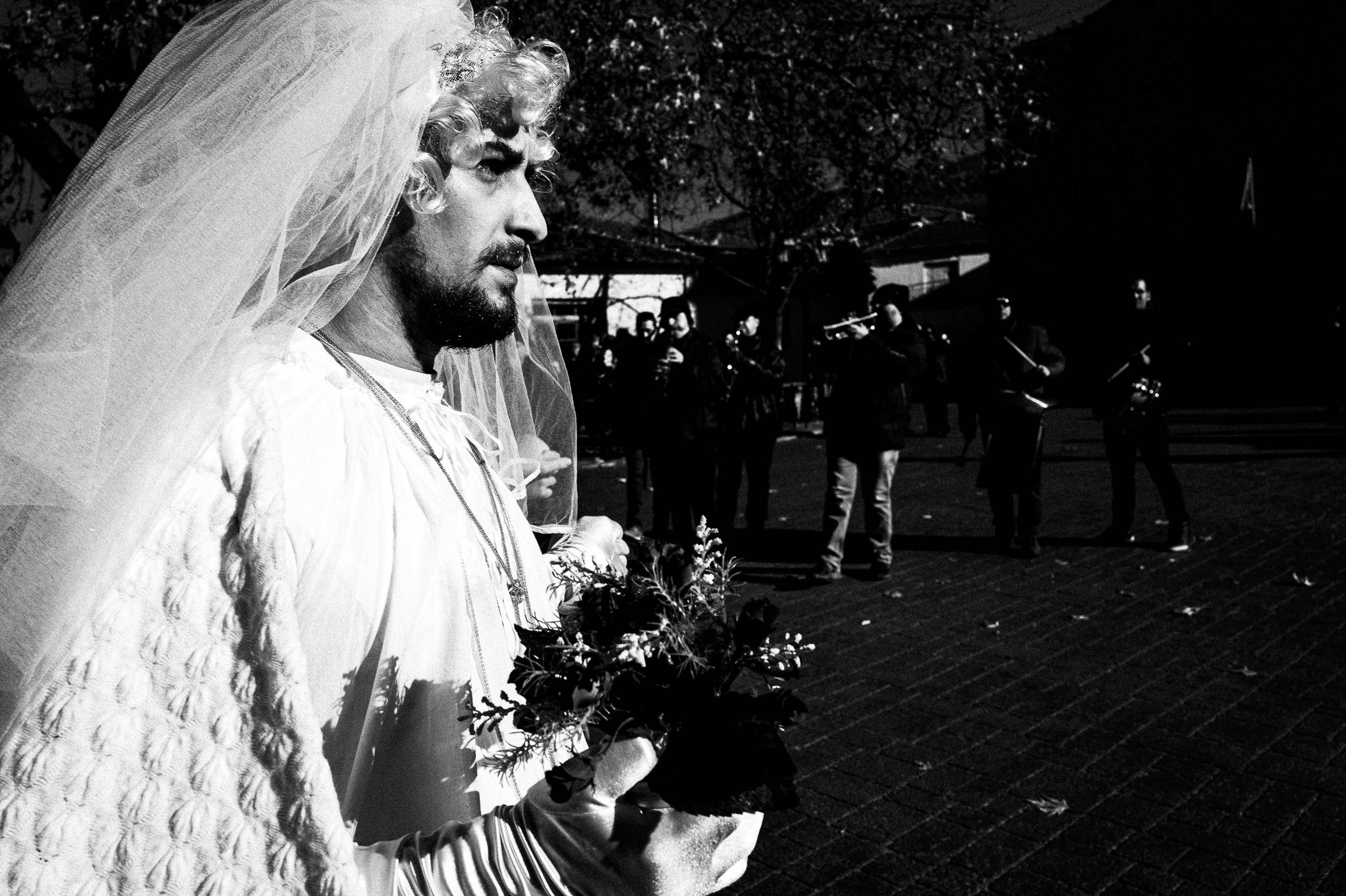 The bride dancing at the main square, Pagan Christmas customs of Northern Greece, by photographer George Tatakis