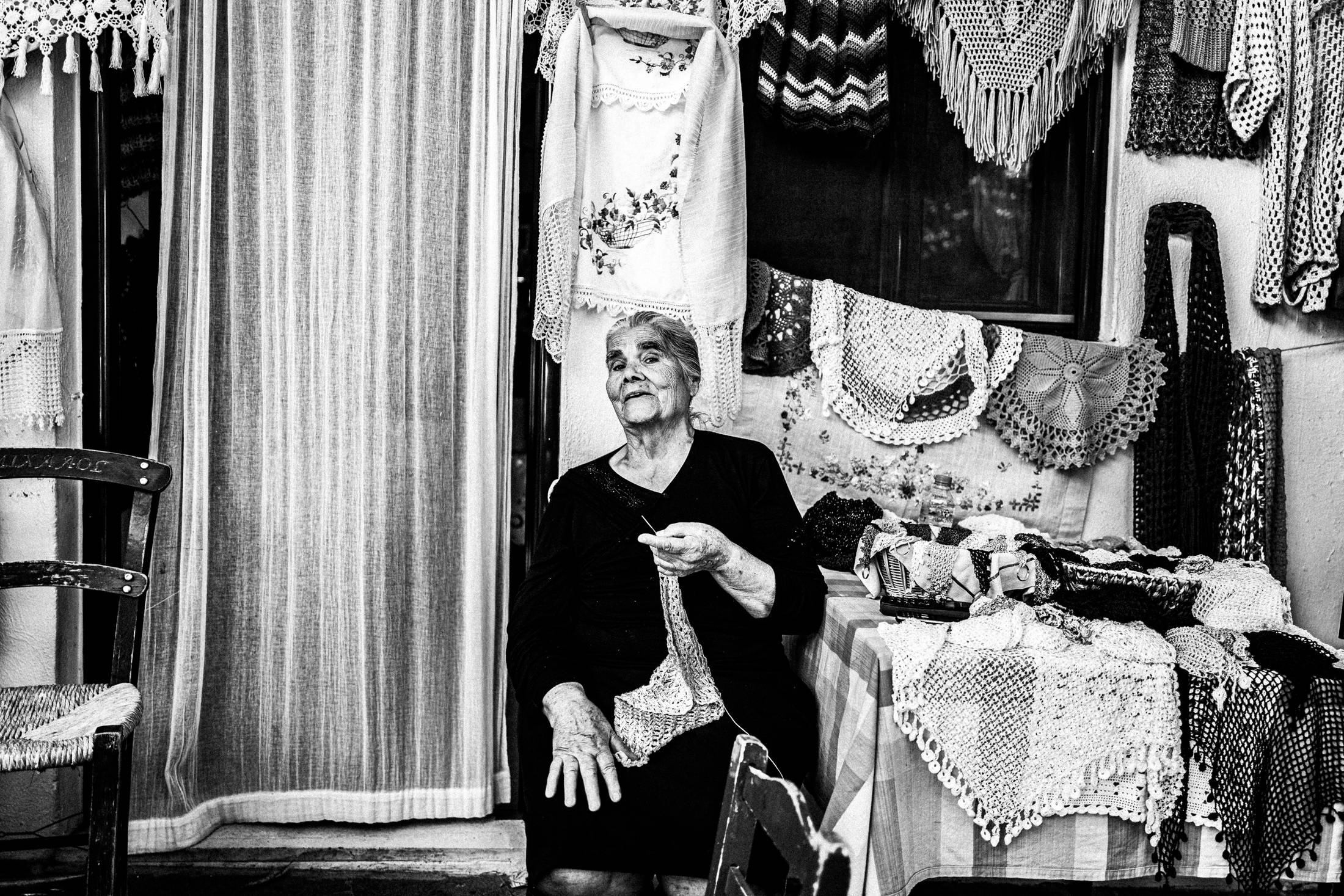 A local shop owner in Anogia, Rethymnon, Crete, by photographer George Tatakis