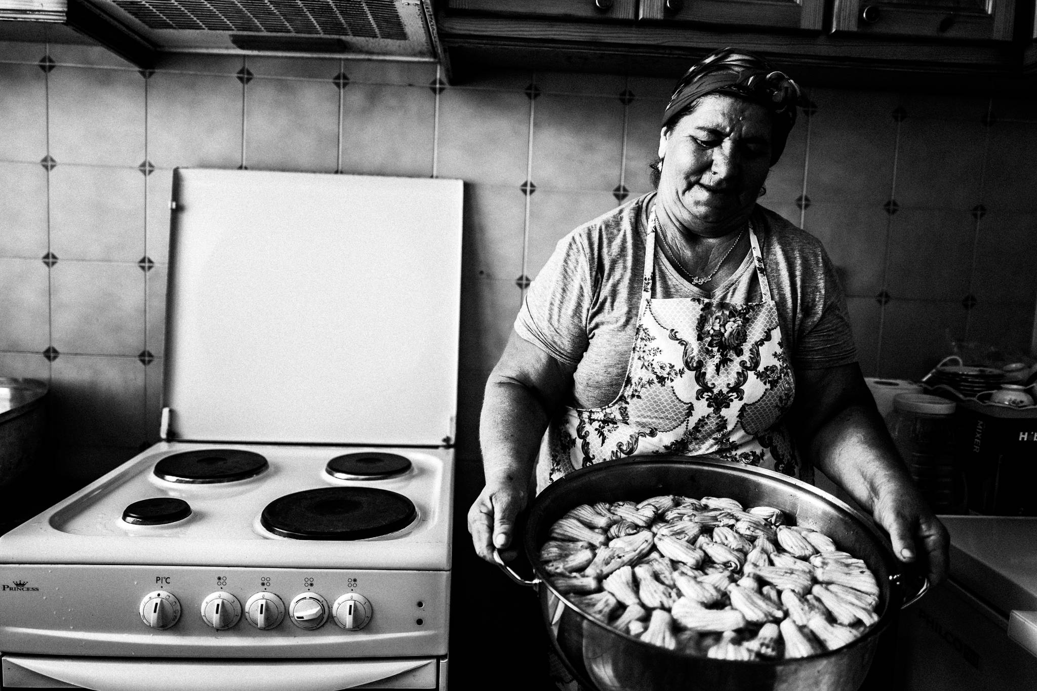 Ayshe cooking in her house in Platani, Kos, by photographer George Tatakis