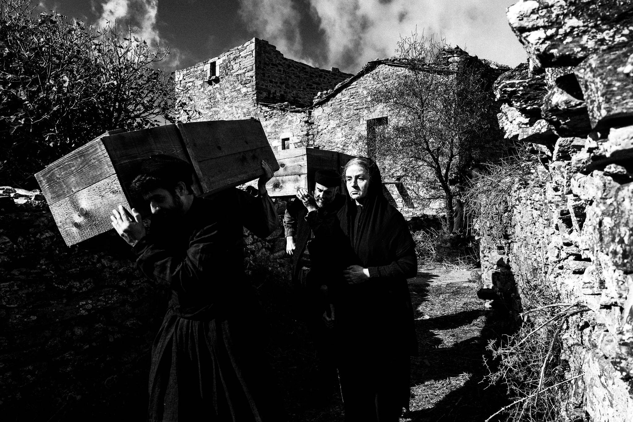 Attending the Funeral in 'Fonissa'. Black and white photography by George Tatakis during the filming of 'Φόνισσα'(Fonissa).