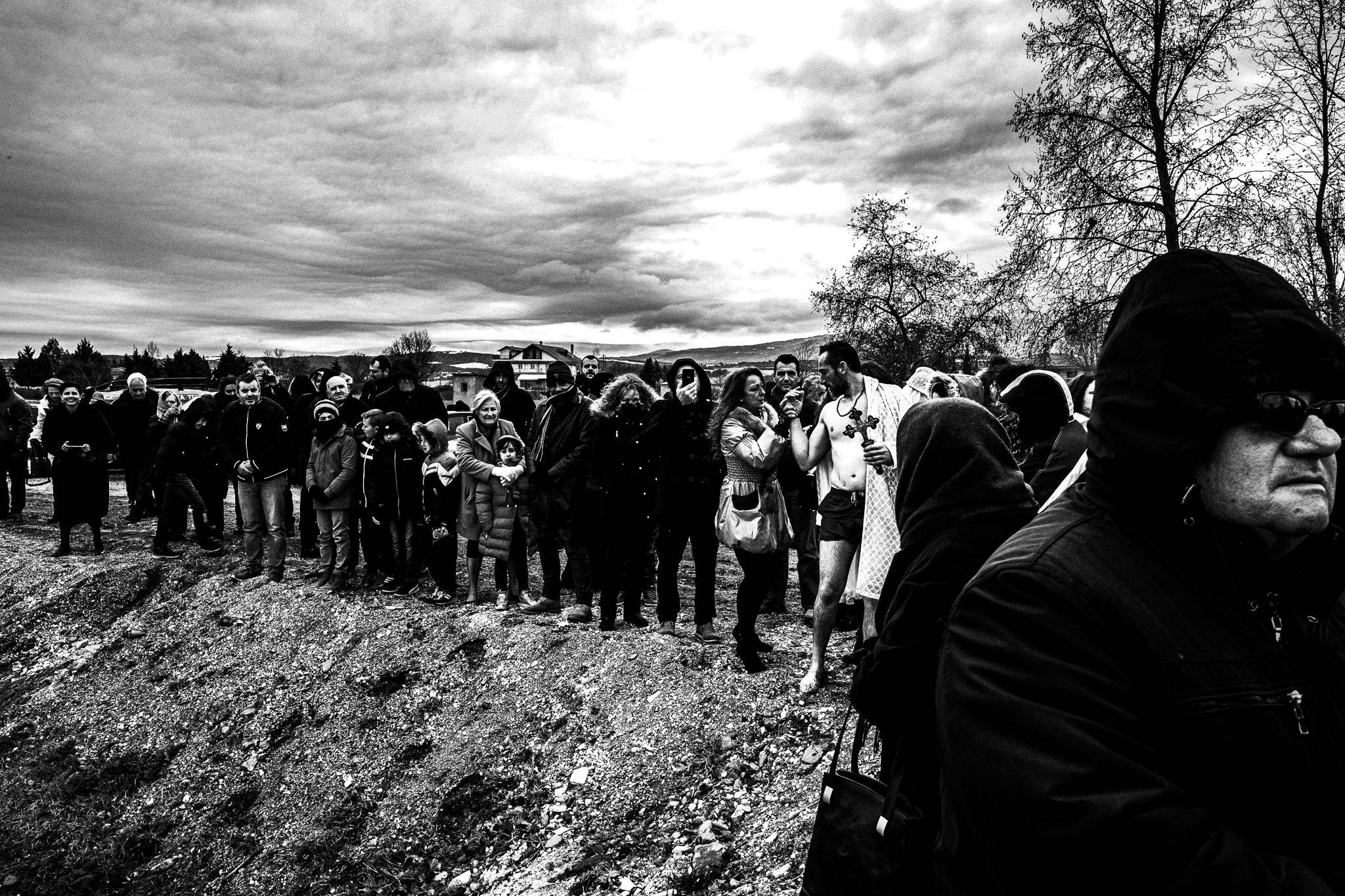 Getting dry after catching the cross, Pagan Christmas customs of Northern Greece, by photographer George Tatakis