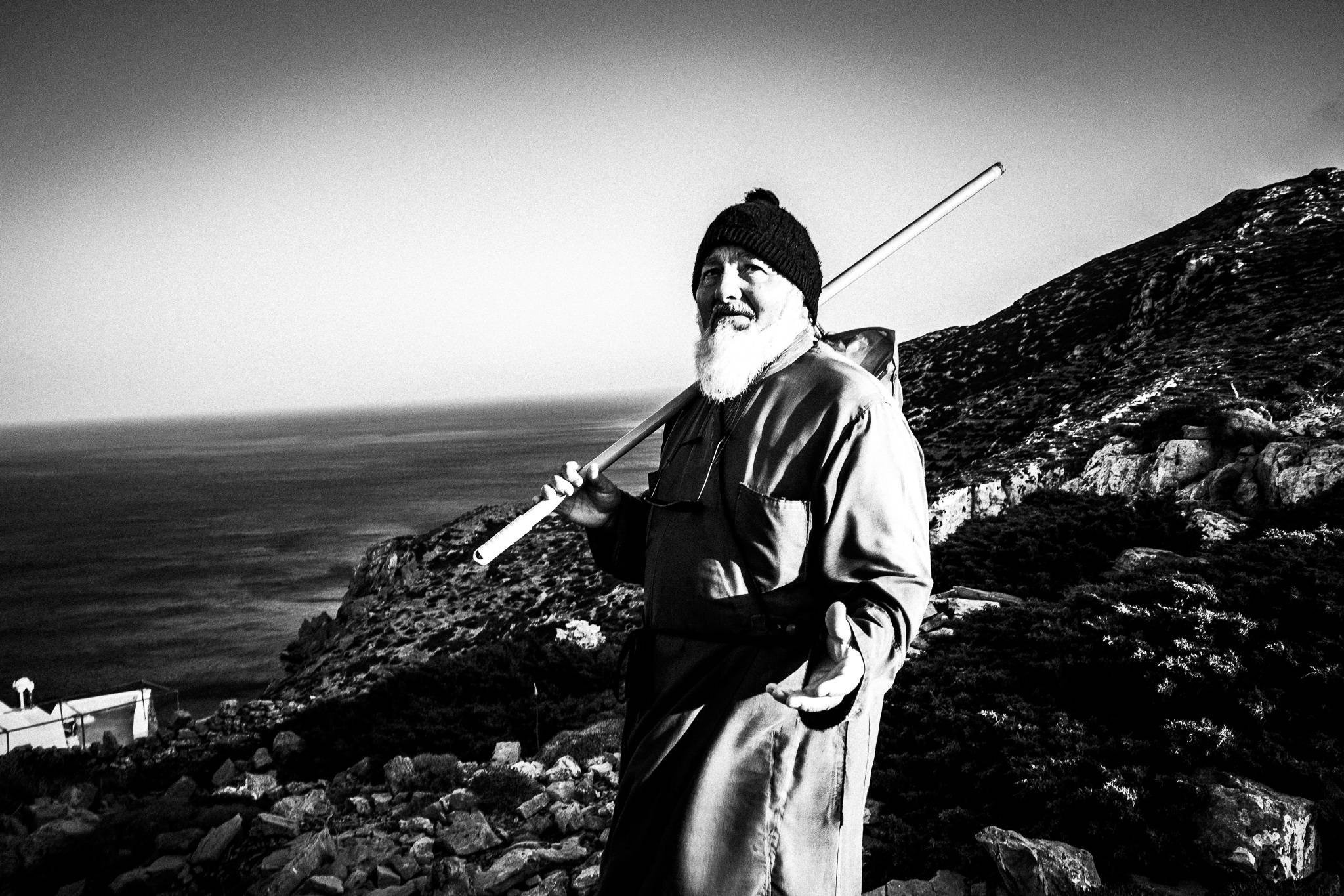 Papa-Minas at the festival of St. Zacharias at Argos on the island of Saria, Olympos, Karpathos, Greece. Black and white photography by George Tatakis