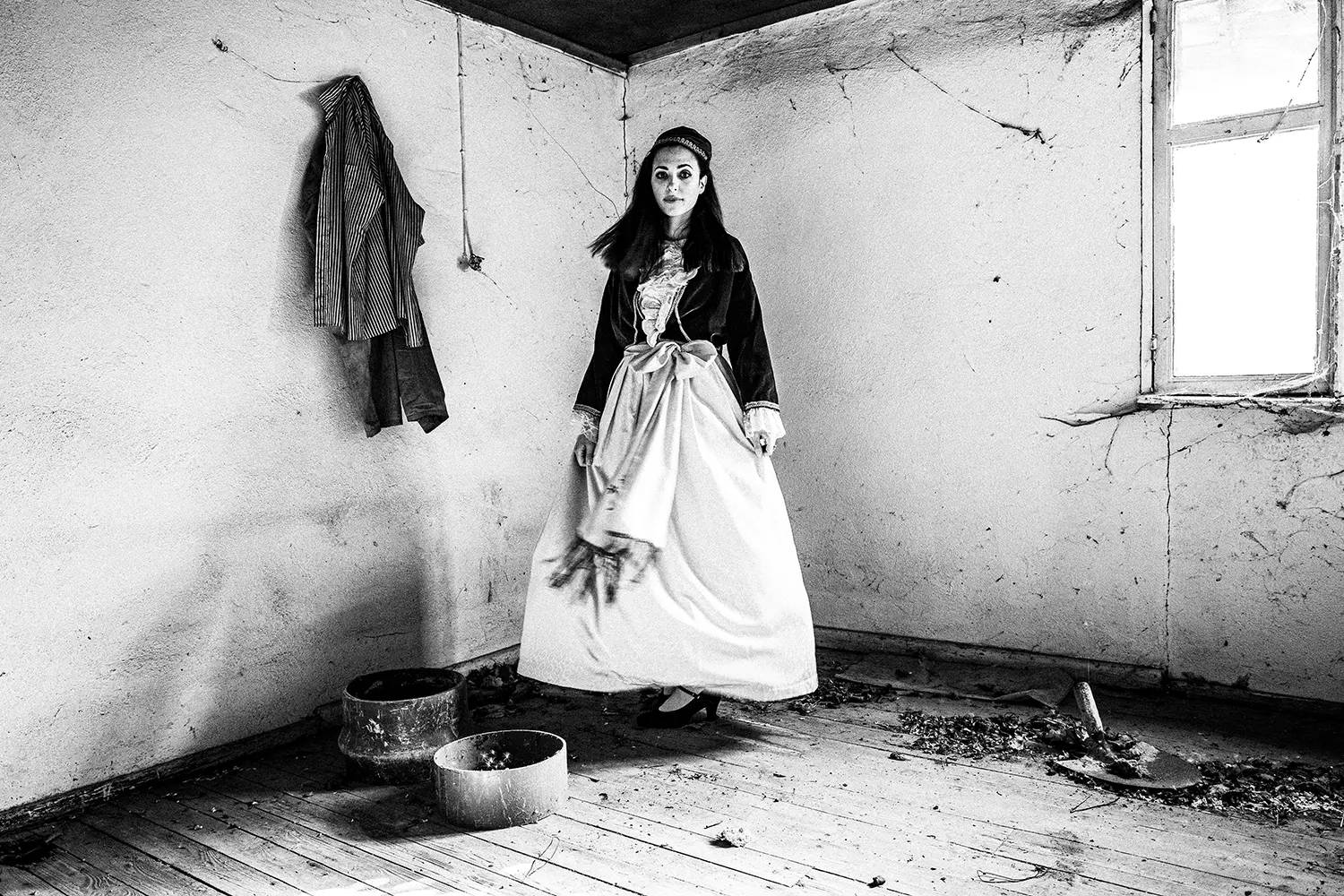 A woman wearing the urban folklore dress of Pelion, Thessaly, Greece. Black and white photography by George Tatakis