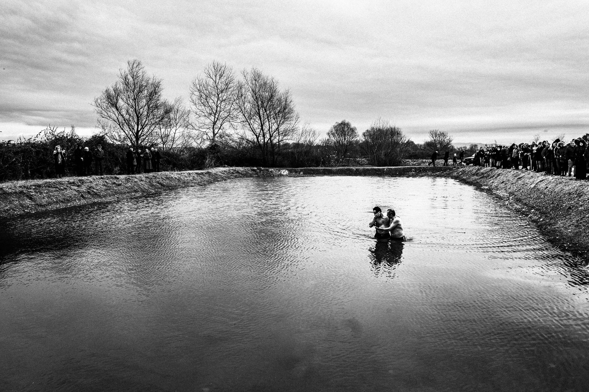Diving to catch the cross, Pagan Christmas customs of Northern Greece, by photographer George Tatakis