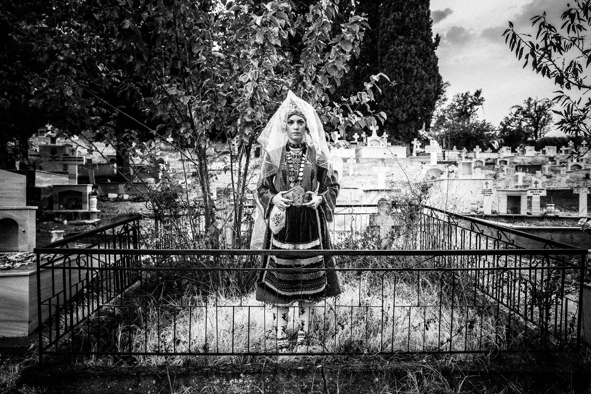 The bride at the local cemetery in Metaxades, Evros, Thrace, Greece, by photographer George Tatakis