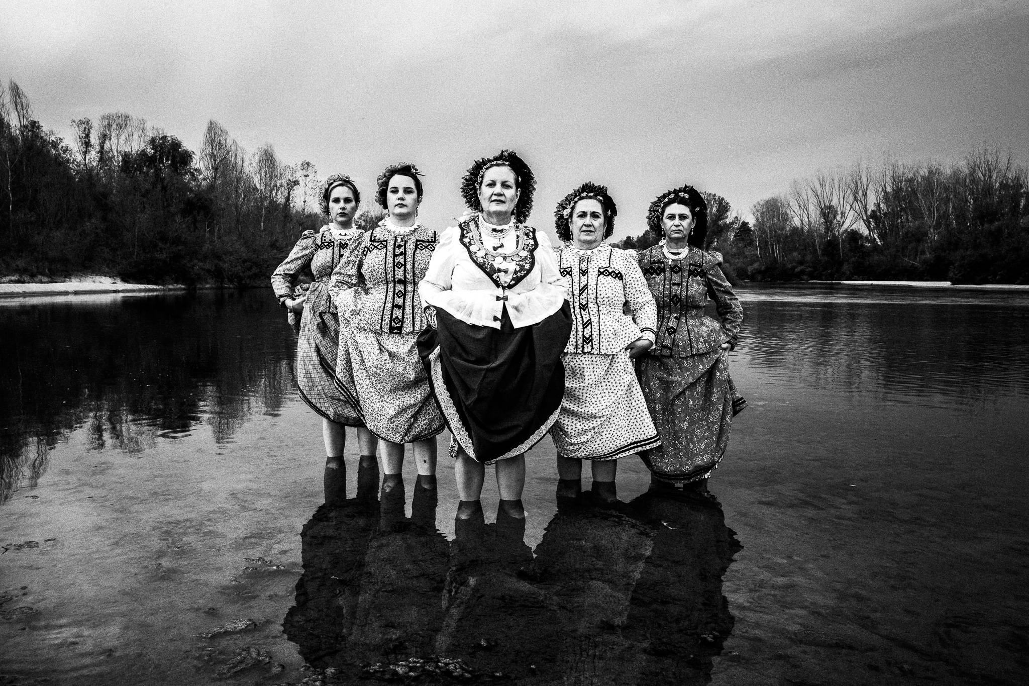 The ladies inside Ardas river wearing the traditional costumes of Nea Vyssa, Evros, Thrace, Greece