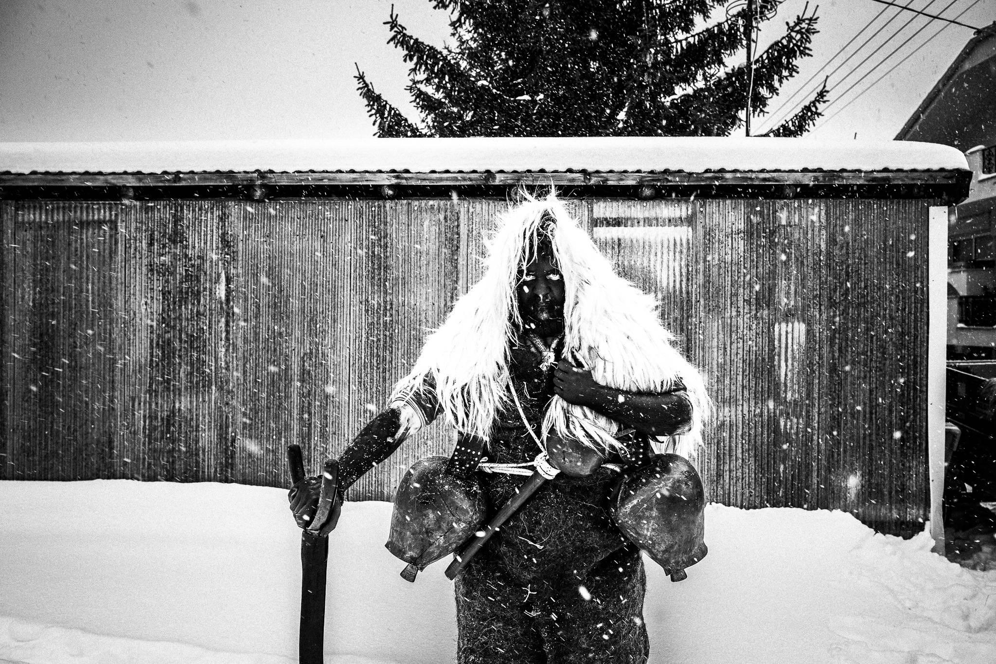 An Arapis in the snow, ready for the event, Pagan Christmas customs of Northern Greece, by photographer George Tatakis