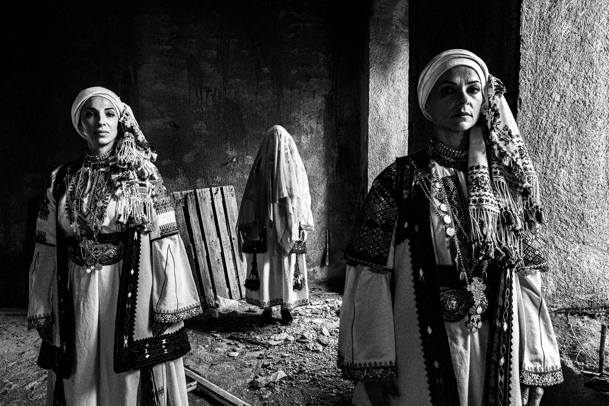 Three women wearing the local costumes of Kyparissia, in Peloponnese, Greece.