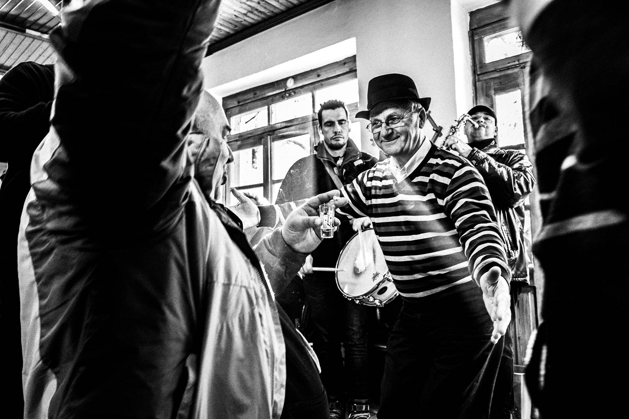 Dancing inside the café, Pagan Christmas customs of Northern Greece, by photographer George Tatakis