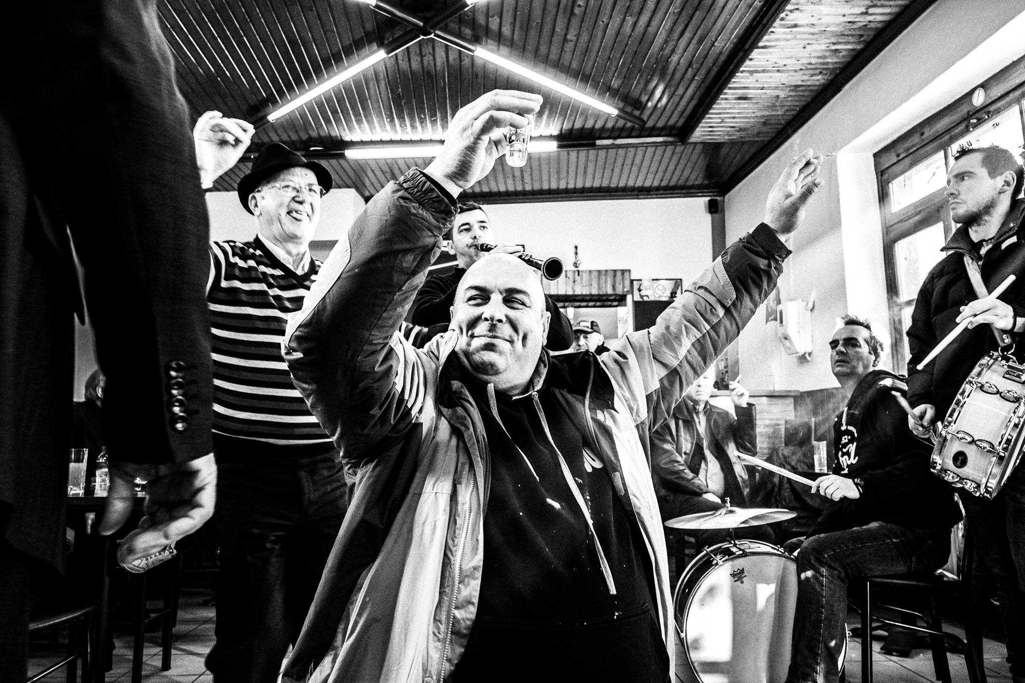 Dancing inside the café, Pagan Christmas customs of Northern Greece, by photographer George Tatakis