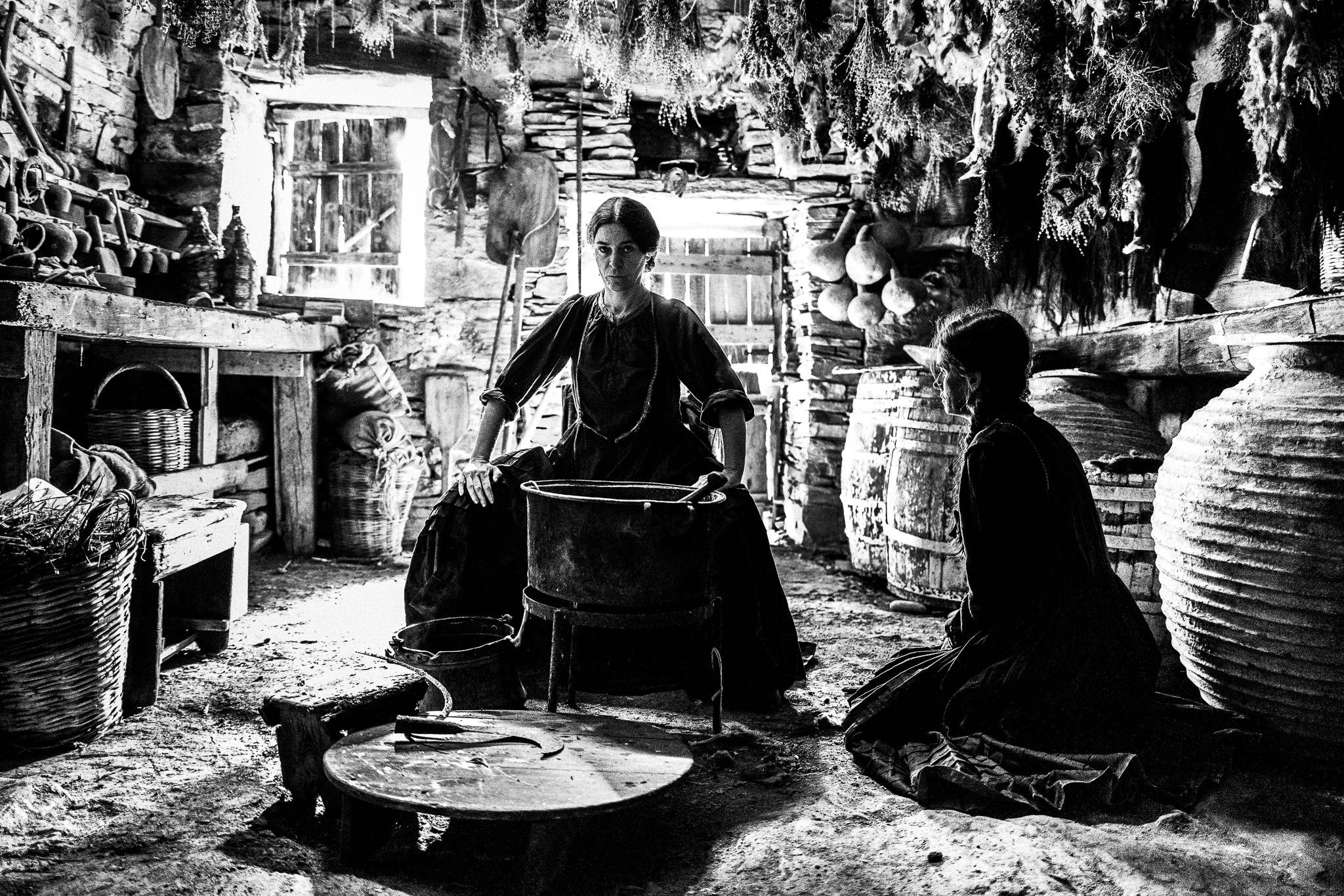 Flashback with Fonissa's mother (Maria Protopappas) with young Hadoula (Georgianna Ntalaras). Black and white photography by George Tatakis during the filming of 'Φόνισσα'(Fonissa).